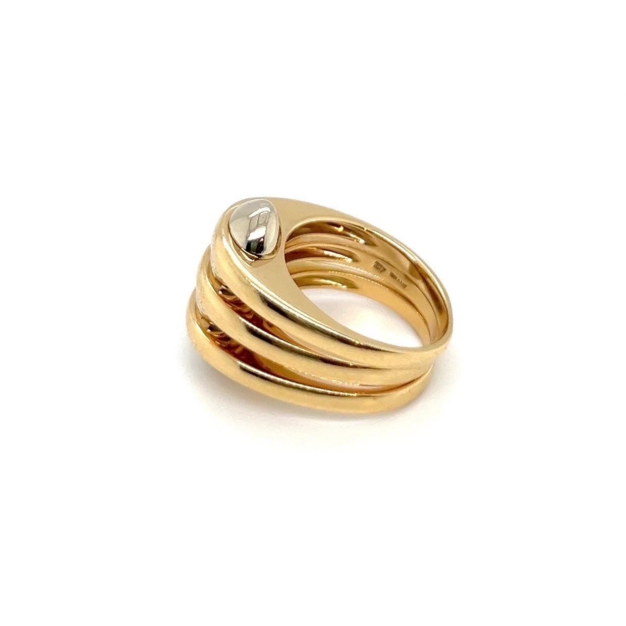 Sleek and minimalist 18 karat bicolor gold ring by renowned Italian jewelry house Bvlgari.

Crafted in 18 karat yellow and white gold, this attractive vintage ring consists of three articulated yellow gold bands, joined by white gold spacers and