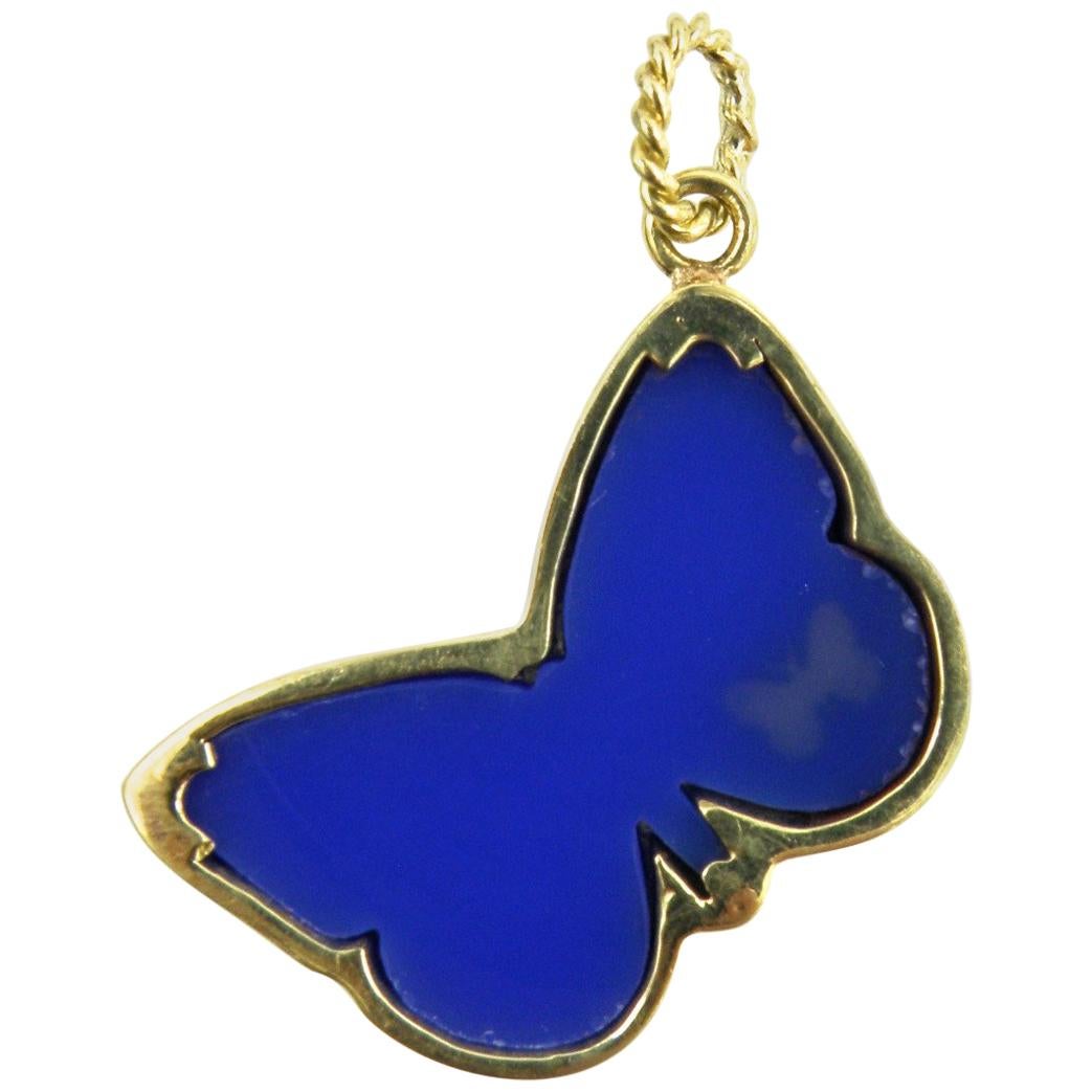 18 karat bezelled butterfly hand carved in blue agate.