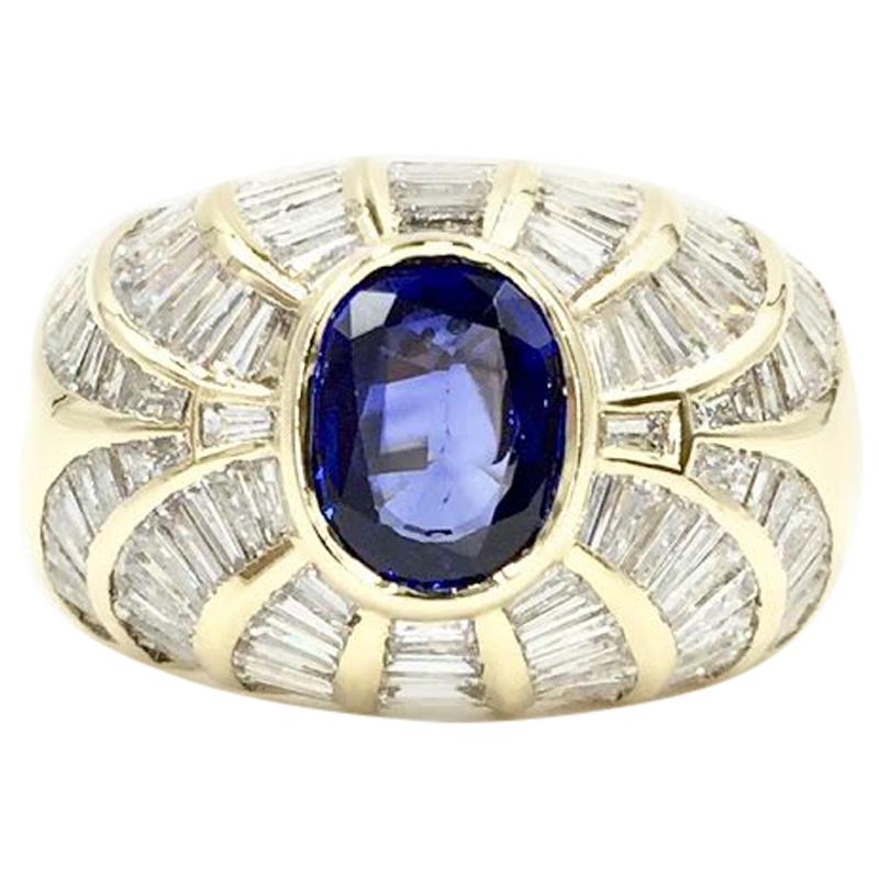 18 Karat Blue Sapphire and Baguette Diamond Cocktail Ring For Sale