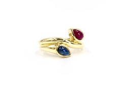 18 Karat Blue Sapphire and Ruby Moi Et Toi Bypass Ring