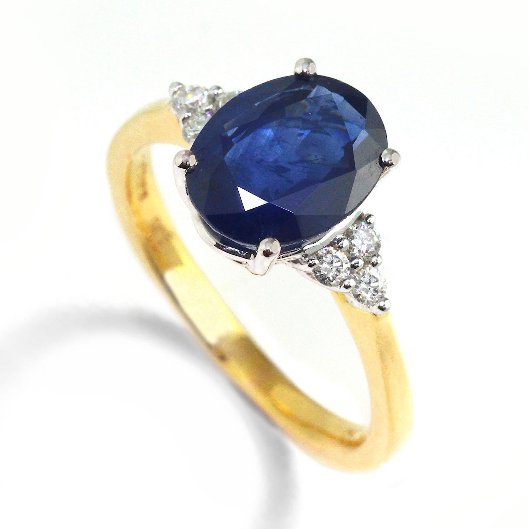 Oval Cut 18 Karat Blue Sapphire Diamond Ring For Sale