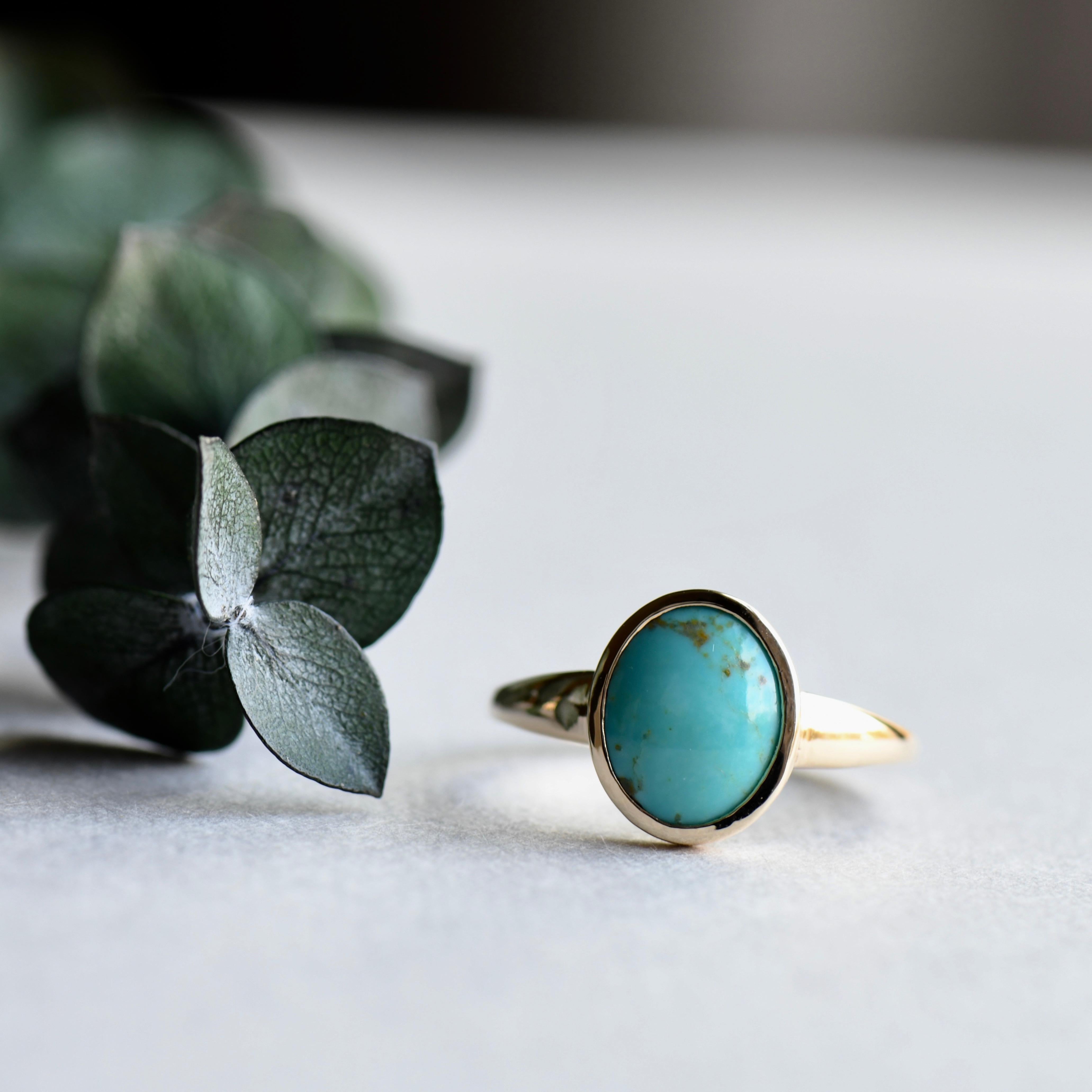 Simple American Mined blue turquoise set on 14k yellow gold.
Metal type:18 karat yellow gold
1.4mm band width. 
8mmX 10mm Genuine North American turquoise. 

All of our jewelry will arrive in custom packaging ready for gift giving. 

LEAD TIME:
Made