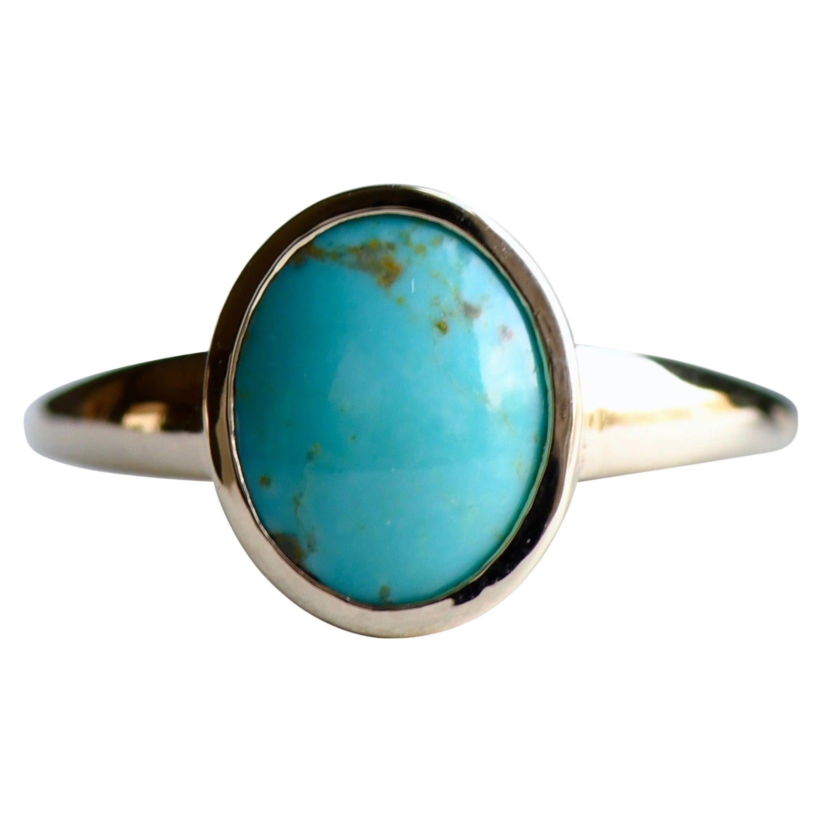 Bague cocktail ovale en or 18 carats et turquoise bleue