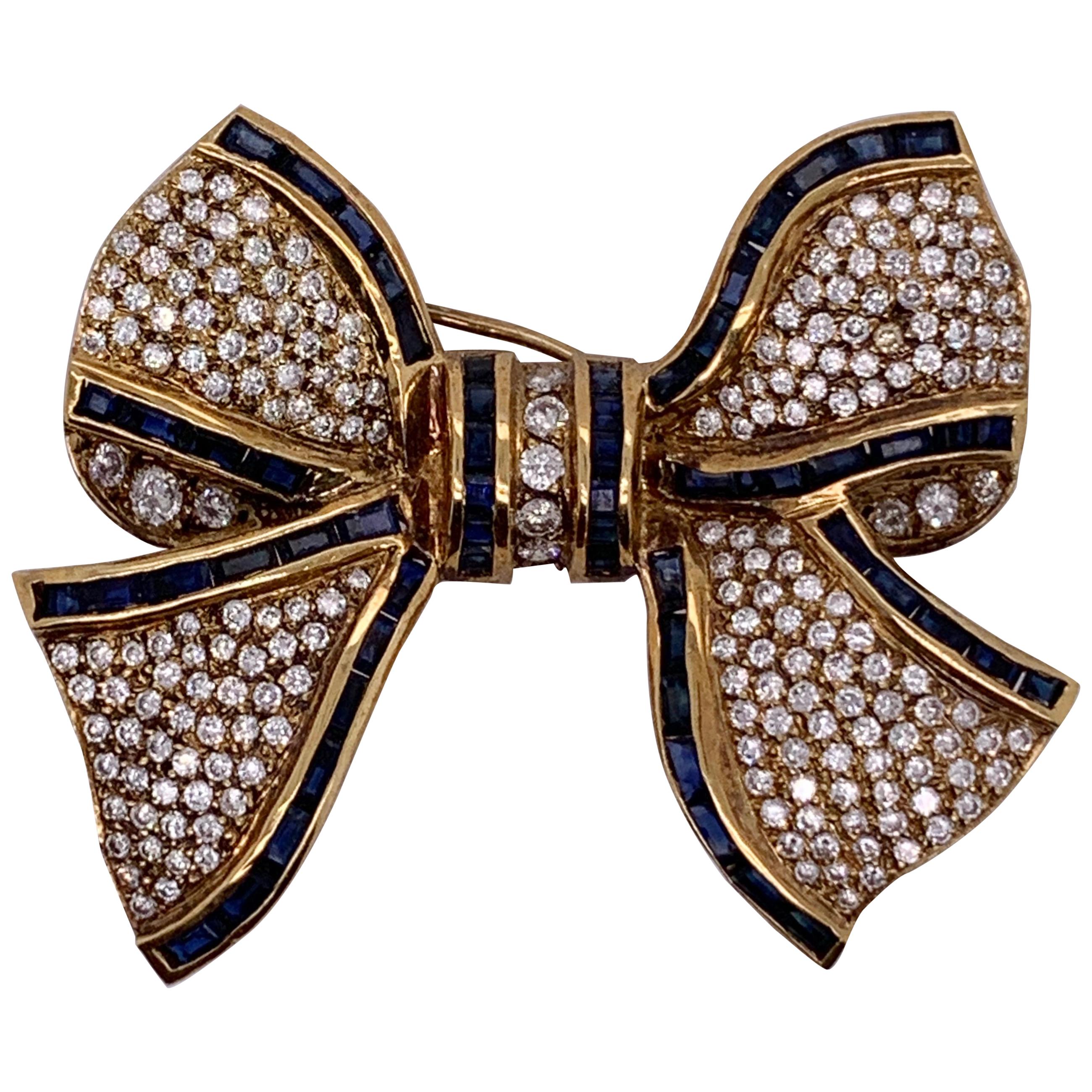 18 Karat Bow Brooch Pin Diamonds and Sapphires Designed in Yellow Gold
