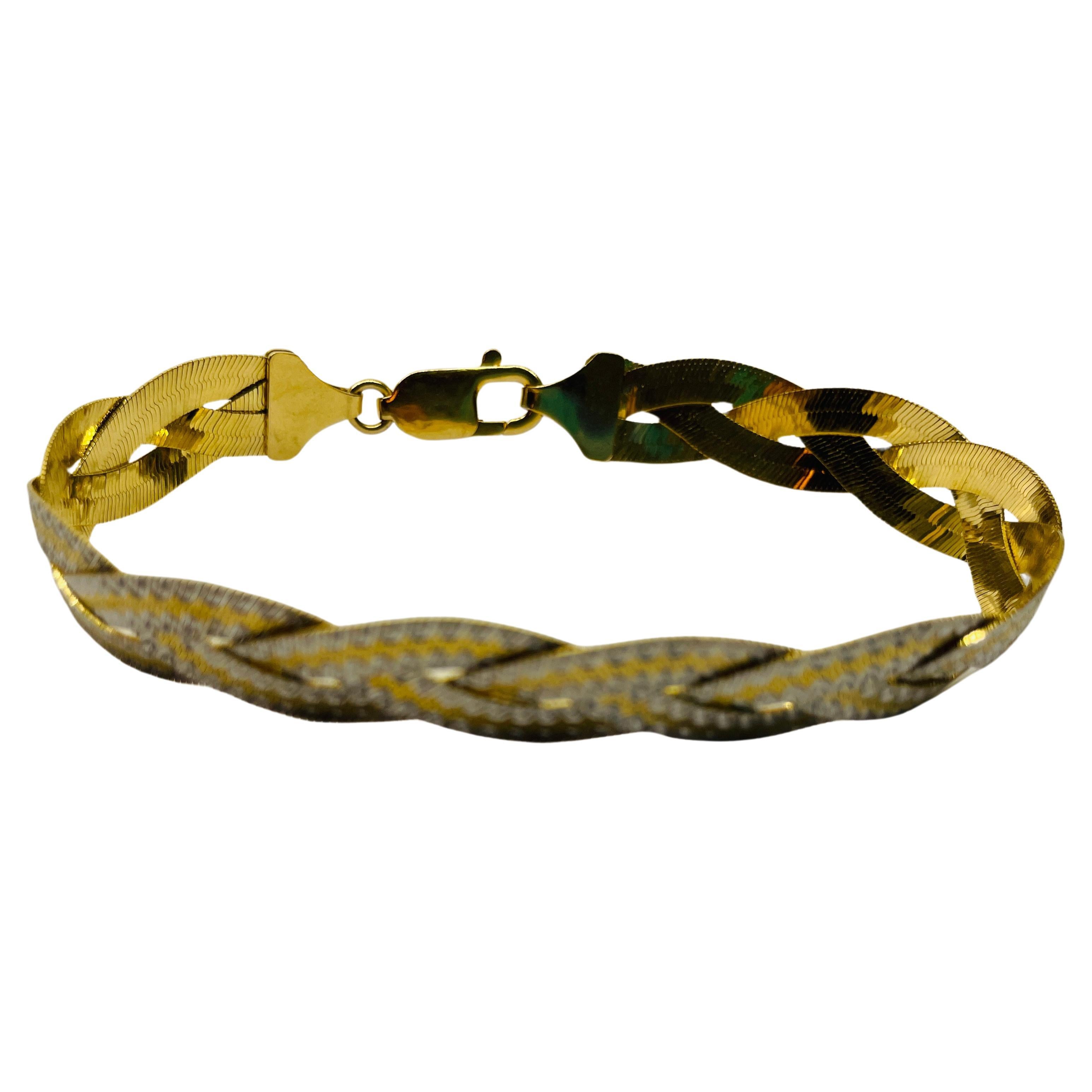 Two-Tone 18k Gold Braided Reversible Bracelet, 
Yellow gold and white gold.  
French Art Deco style one side is two-tone with white and gold stripes alternating across the braided herringbone bracelet - the other side is yellow gold.  
Lobster