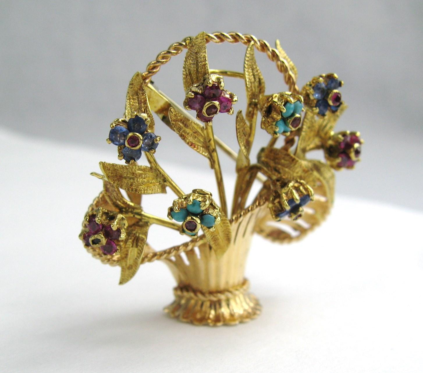  Lovely 18K Gold Tremblant brooch. Rubies, Turquoise, and Sapphire This is fabulous, each flower trembles and spins.  Has a loop on the back to add a chain. The brooch is hallmarked 750 and 1021 AL for the province of Alessandria Italy. This is out