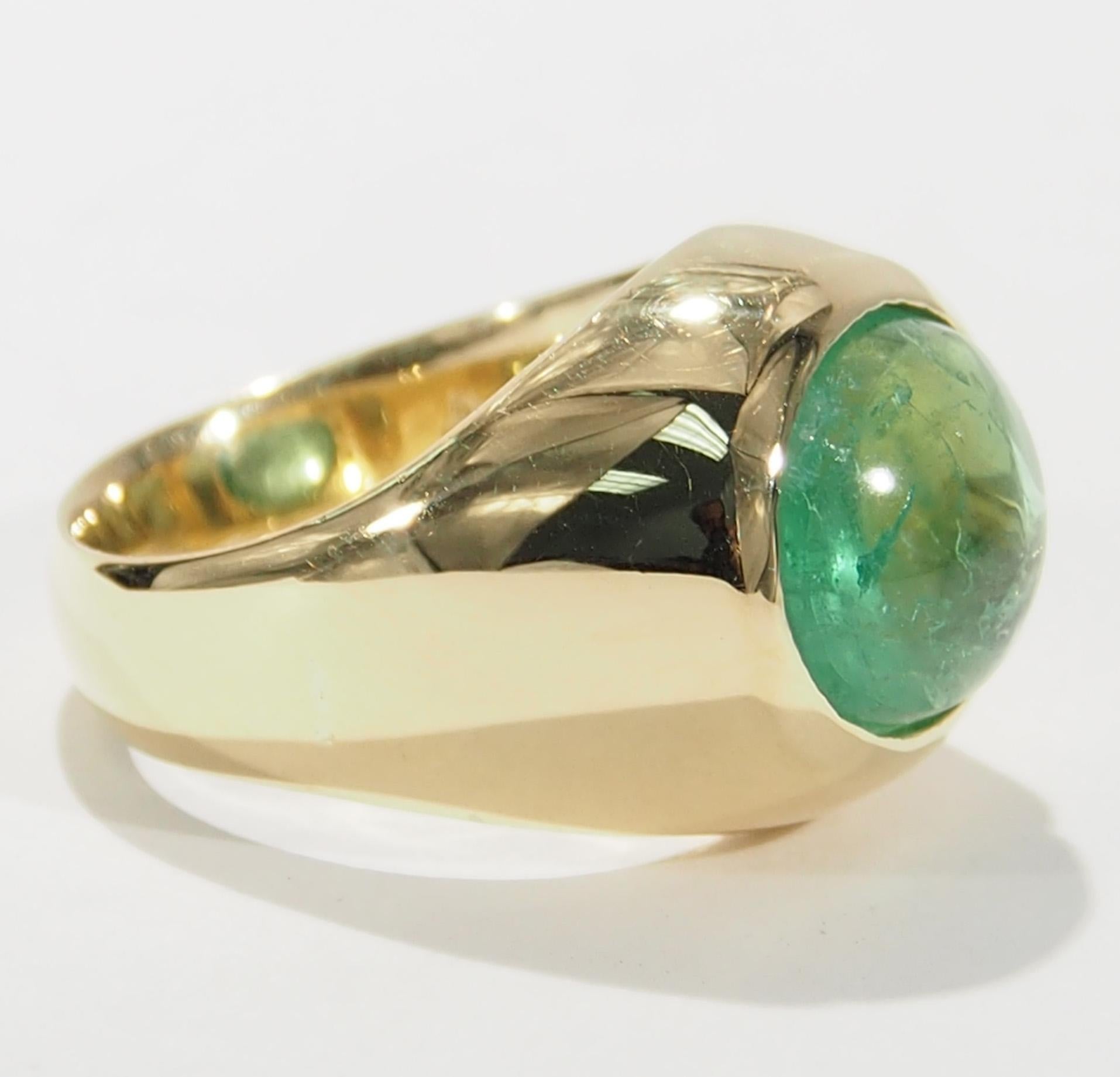 This is a stunning 18K Yellow Gold Dome Ring fashioned with a 6.00ct  Emerald Cabochon. A delightful ring that is easily worn for any occasion. The Ring is 1/2 inch in width, is a size 5 and weighs approximately 12.75 grams.