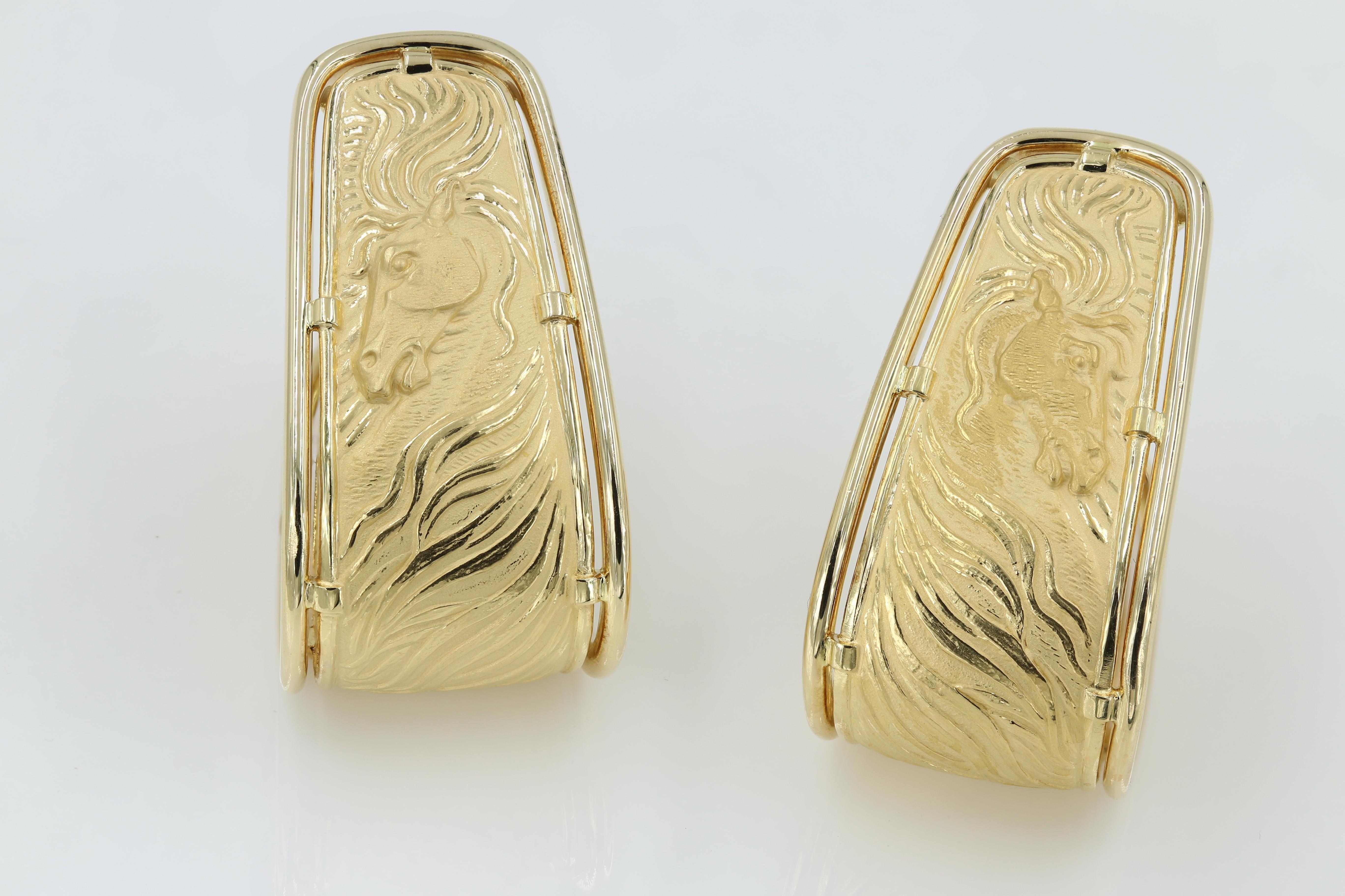 Carrera y Carrera Earrings in 18kt. Yellow Gold earrings with a striking “Horse” theme and is finished with post and omega clip backs. Earrings hang approximately 1.75 inches in length. CyC serial stamped and numbered. Earrings are pre-owned circa