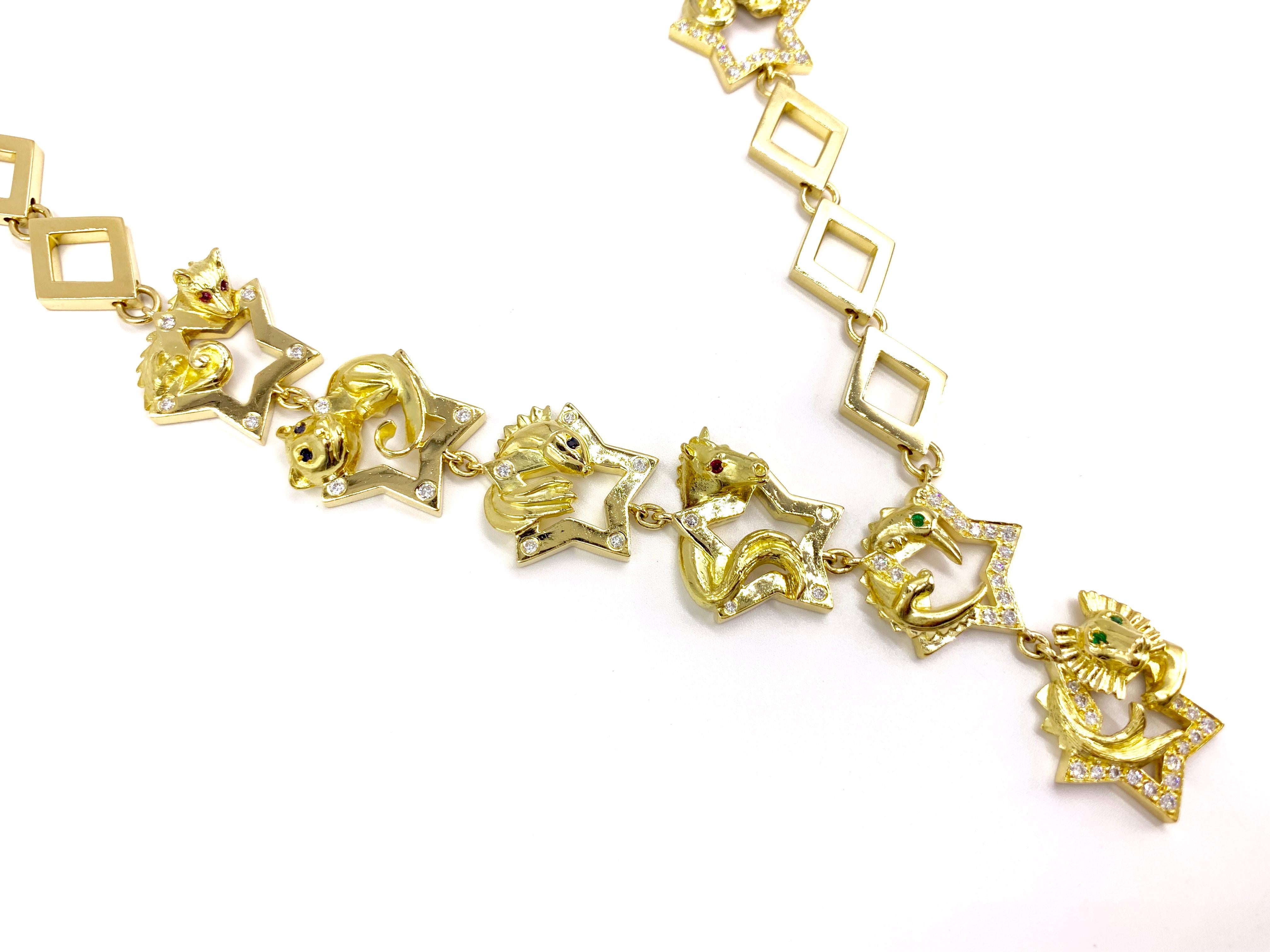 A substantial 18 karat modern animal themed yellow gold lariat style necklace expertly crafted by Charles Turi Jewelry Co. Necklace features seven different adorable carved animals resting upon stars adorned with diamonds. Diamond total weight is