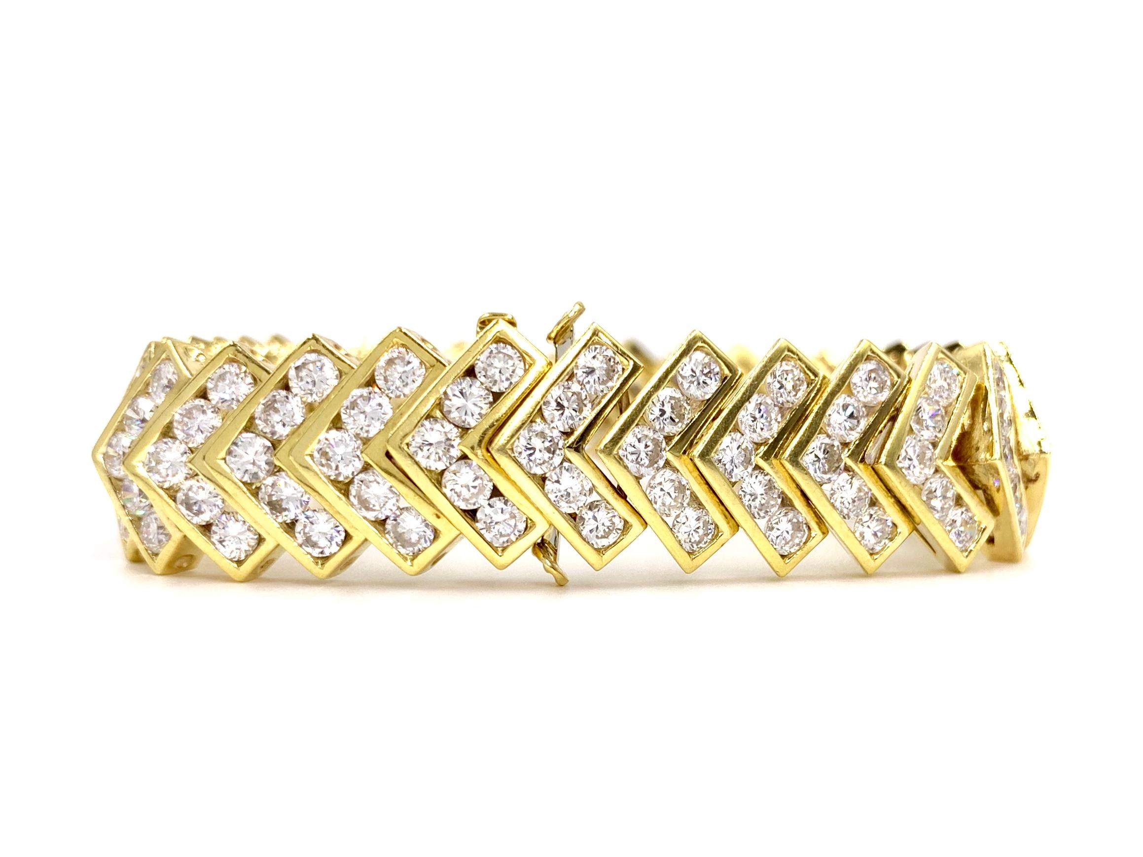Stylish and sleek 18 karat yellow gold modern diamond bracelet with 170 round brilliant diamonds at 14.20 carats total weight. Diamonds are arranged in a contemporary chevron shape, securely set in smooth polished channels. Brilliant diamonds are