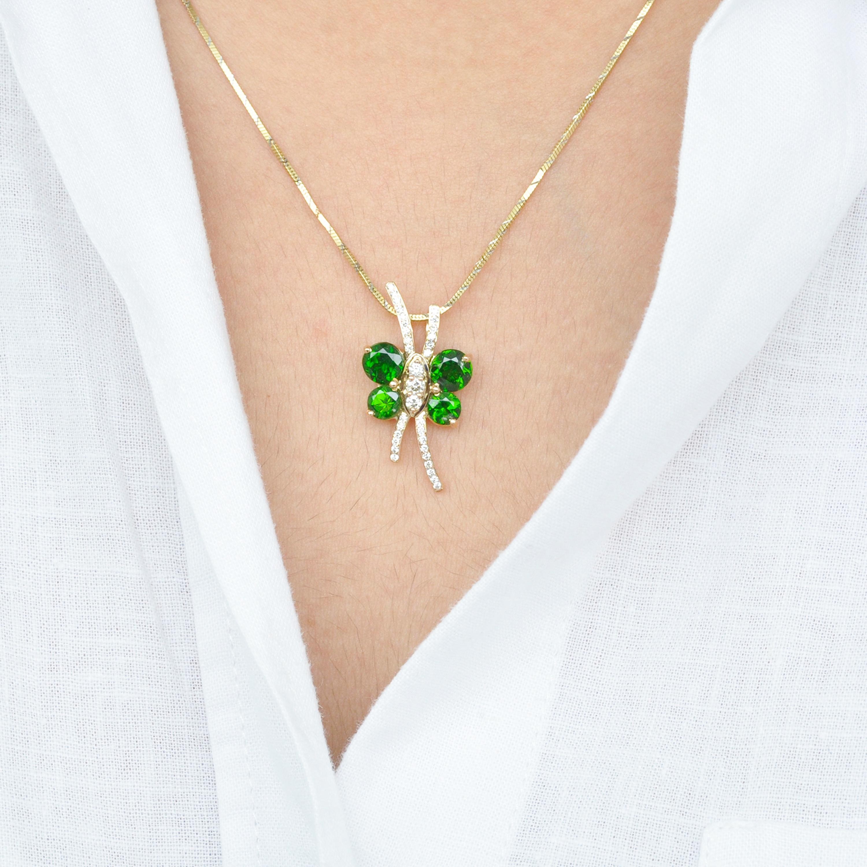 18 karat chrome diopside diamond butterfly pendant necklace.

A chic butterfly pendant necklace is set in 18K Gold using fine quality alloys. Diamonds of quality VVS/VS - G/H are used in the centre to form the body and antenna of the butterfly. The