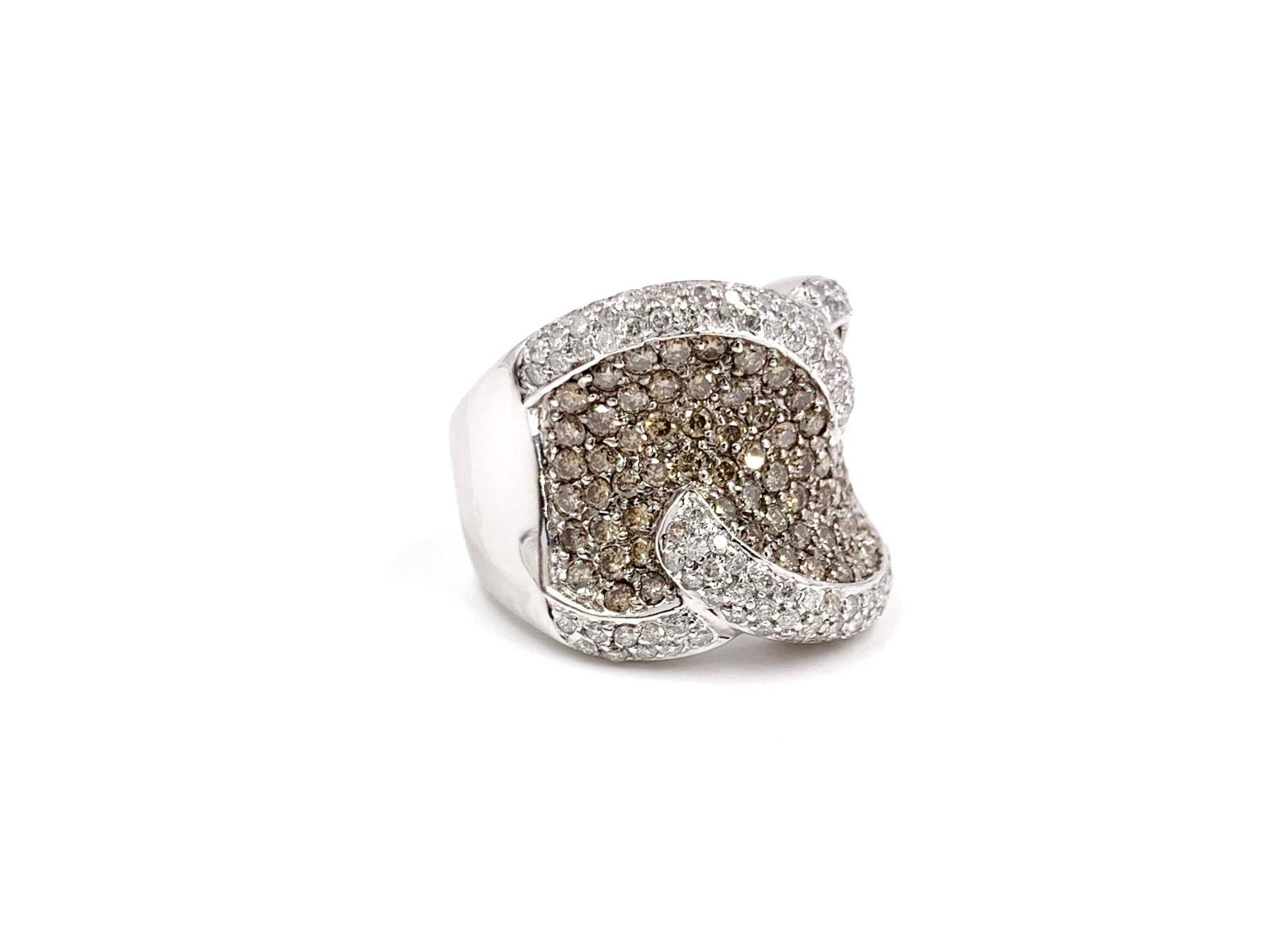 A beautiful and comfortable 18 karat white gold wide curved diamond ring featuring approximately 3 carats in cognac-brown diamonds with approximately 1.25 carats white diamond edges = 4.25 carats total weight. Cognac diamonds are pave set in black