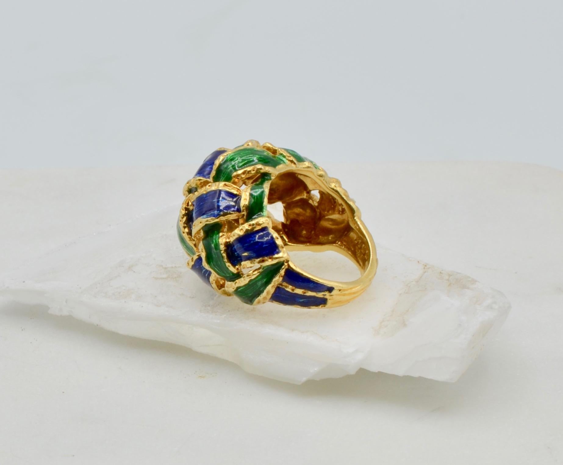This stunner is a statement in emerald and sapphire enamel in 18 karat gold. The ring is very reminiscent of Diana Vreeland or Iris Apfel..... This ring is a size 5 1/2.