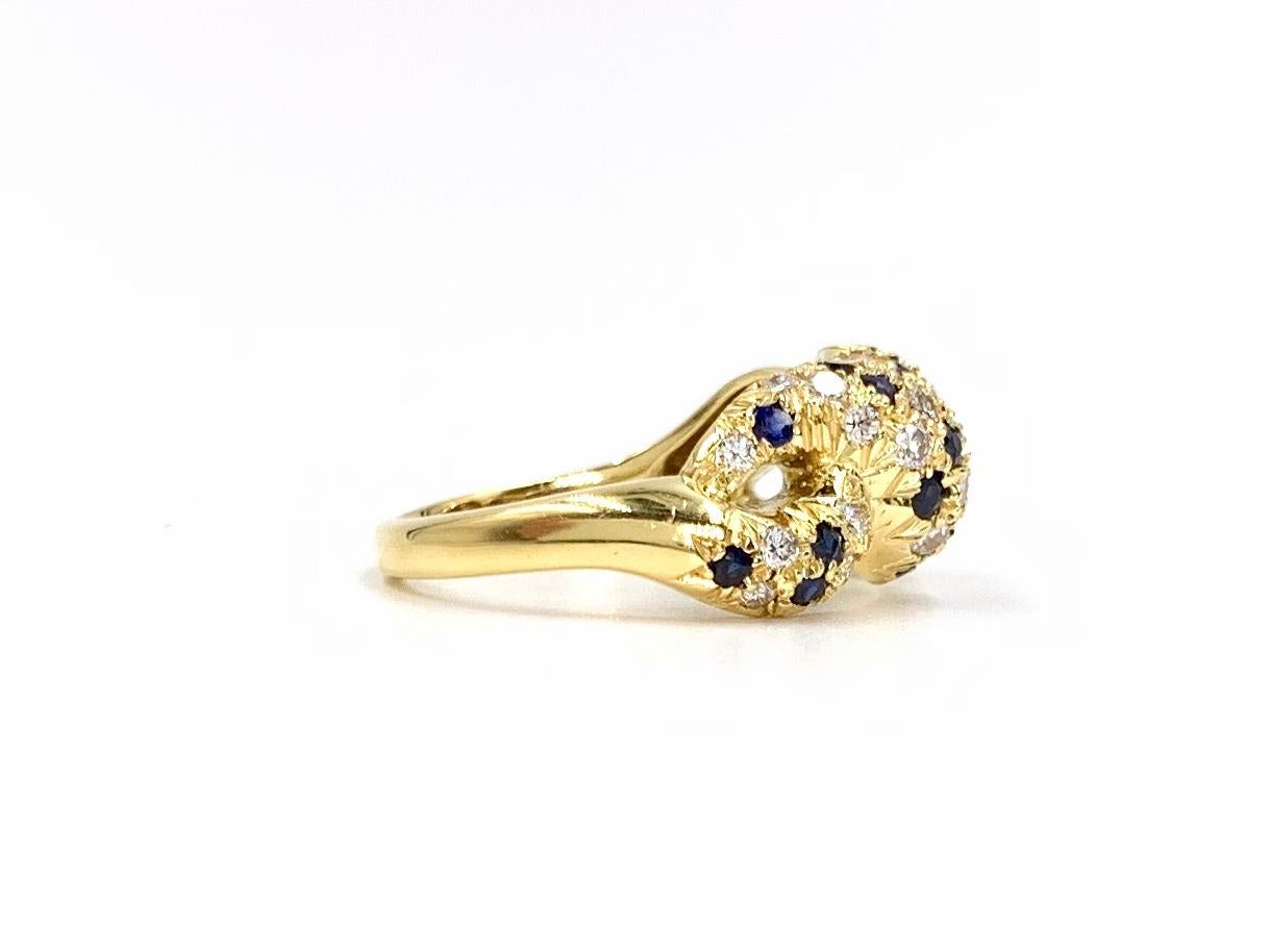 Round Cut 18 Karat Diamond and Blue Sapphire Twisted Ring For Sale