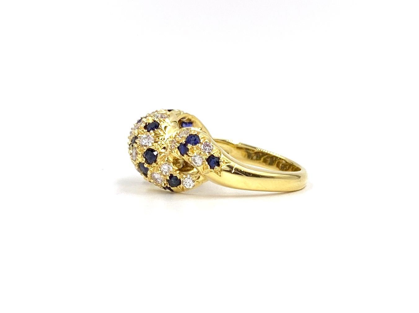 Women's 18 Karat Diamond and Blue Sapphire Twisted Ring For Sale