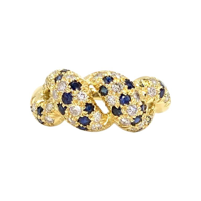 18 Karat Diamond and Blue Sapphire Twisted Ring For Sale