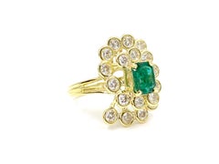 18 Karat Diamond and Emerald Swirl Cocktail Ring