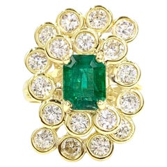 18 Karat Diamond and Emerald Swirl Cocktail Ring