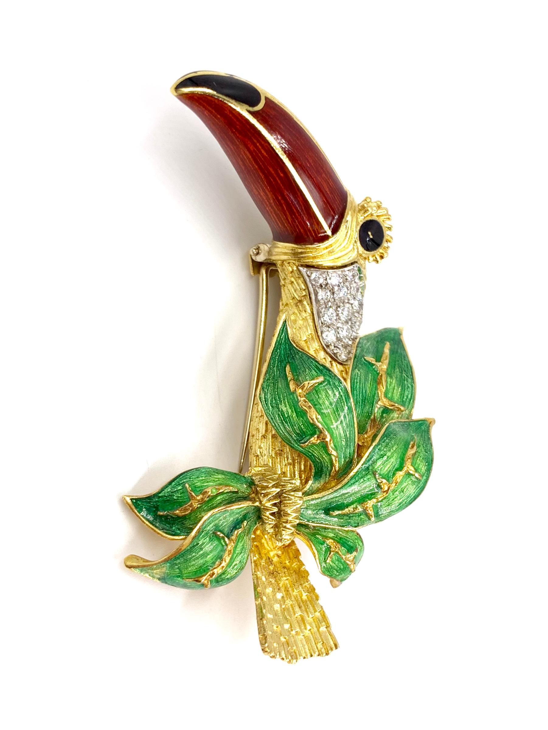 A very well made and detailed 18 karat yellow gold toucan brooch with hand painted enamel and adorned with 13 round brilliant diamonds at approximately .65 carats total weight G color, SI1 clarity. Diamonds are set in white gold for an extra bright