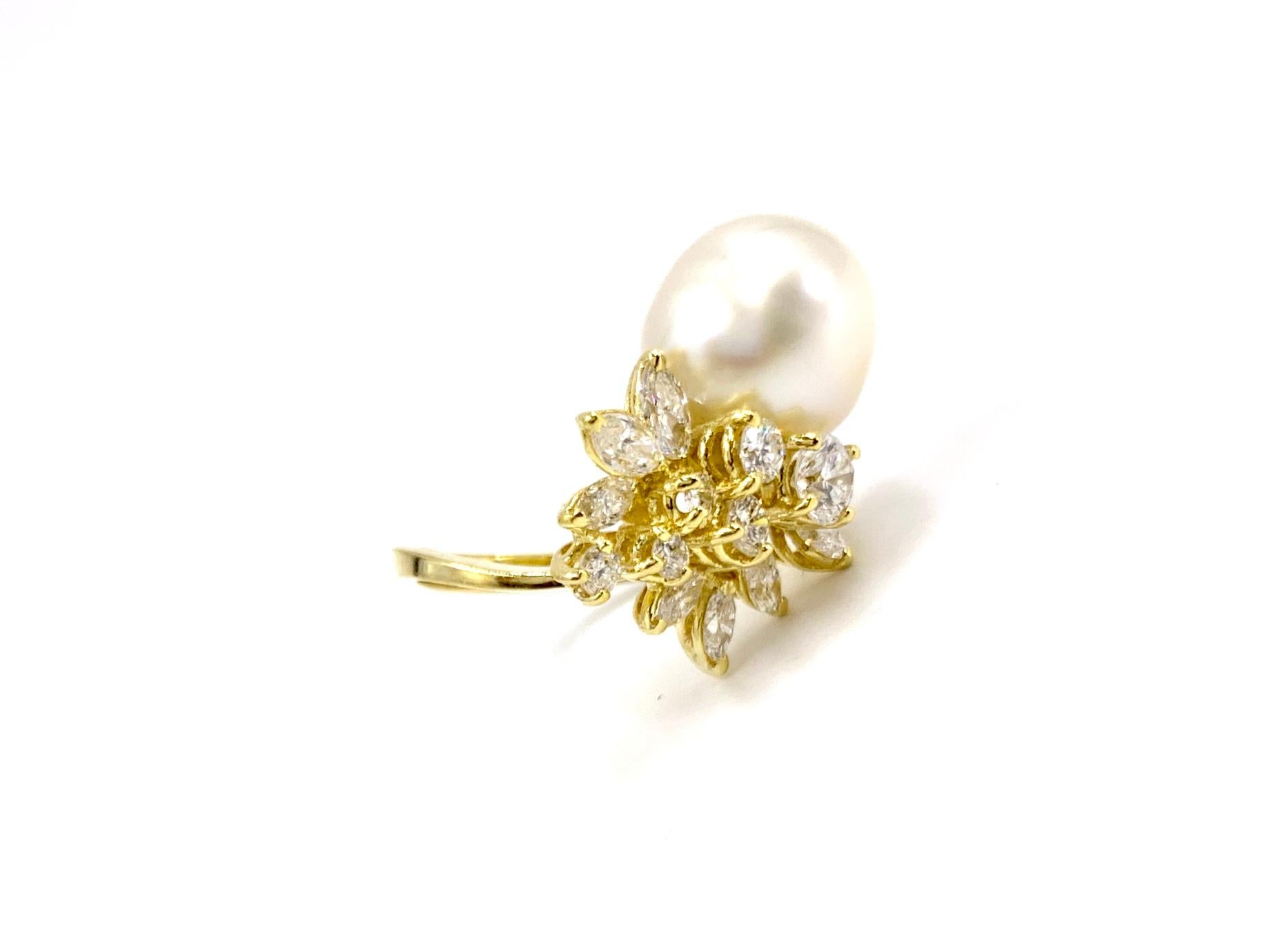 A simply stunning and stylish 18 karat yellow gold south sea pearl and diamond right hand ring. This timeless piece makes a statement yet still carries a slightly delicate design featuring 1.50 carats of round brilliant and marquise shaped diamonds