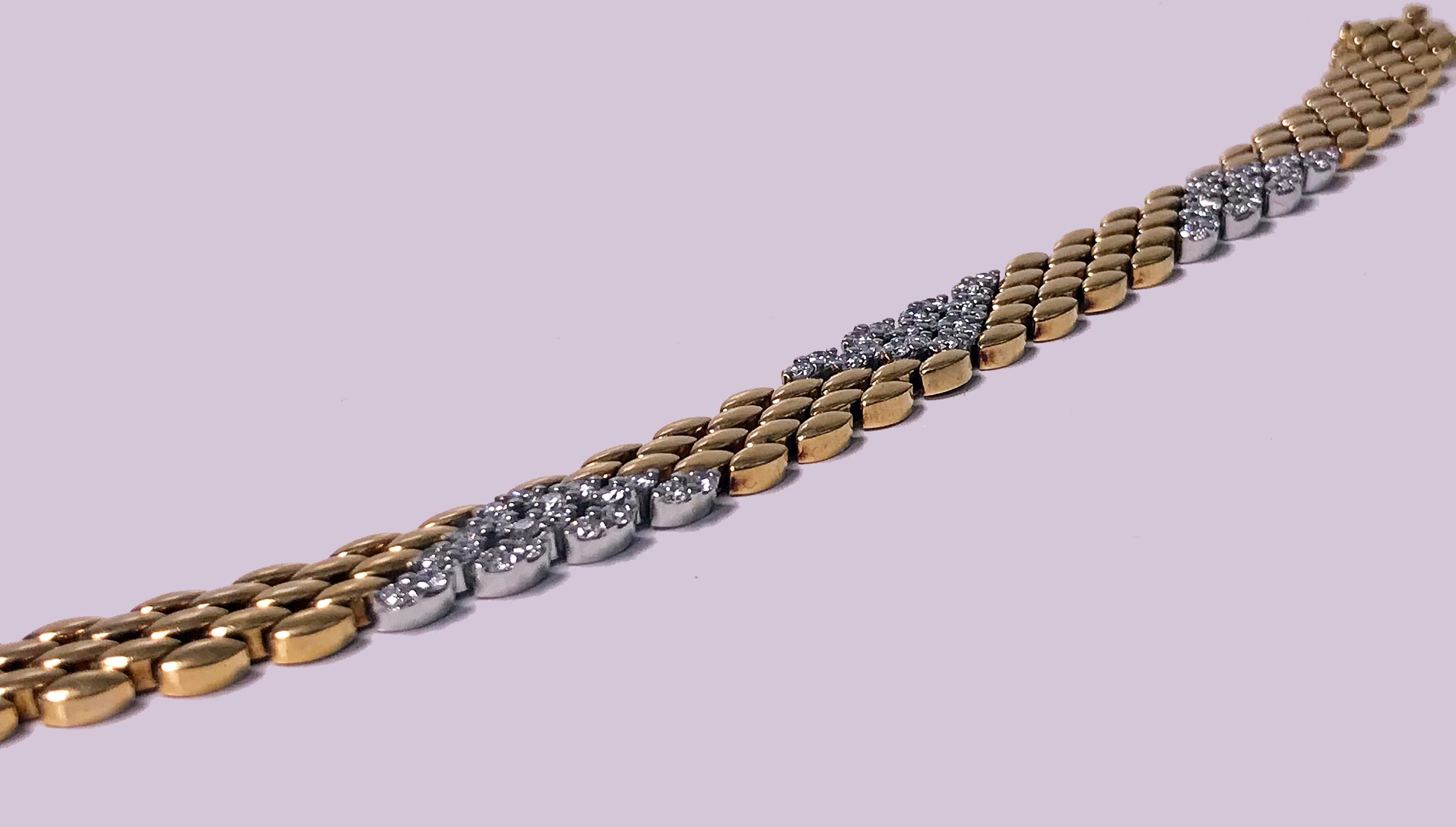 18K Diamond Bracelet, 20th century. The Bracelet of chevron and lozenge polished gold and diamond honey comb design. The three diamond sections set in white gold with a total of sixty round brilliant cut diamonds, approximately 1.80 ct, total