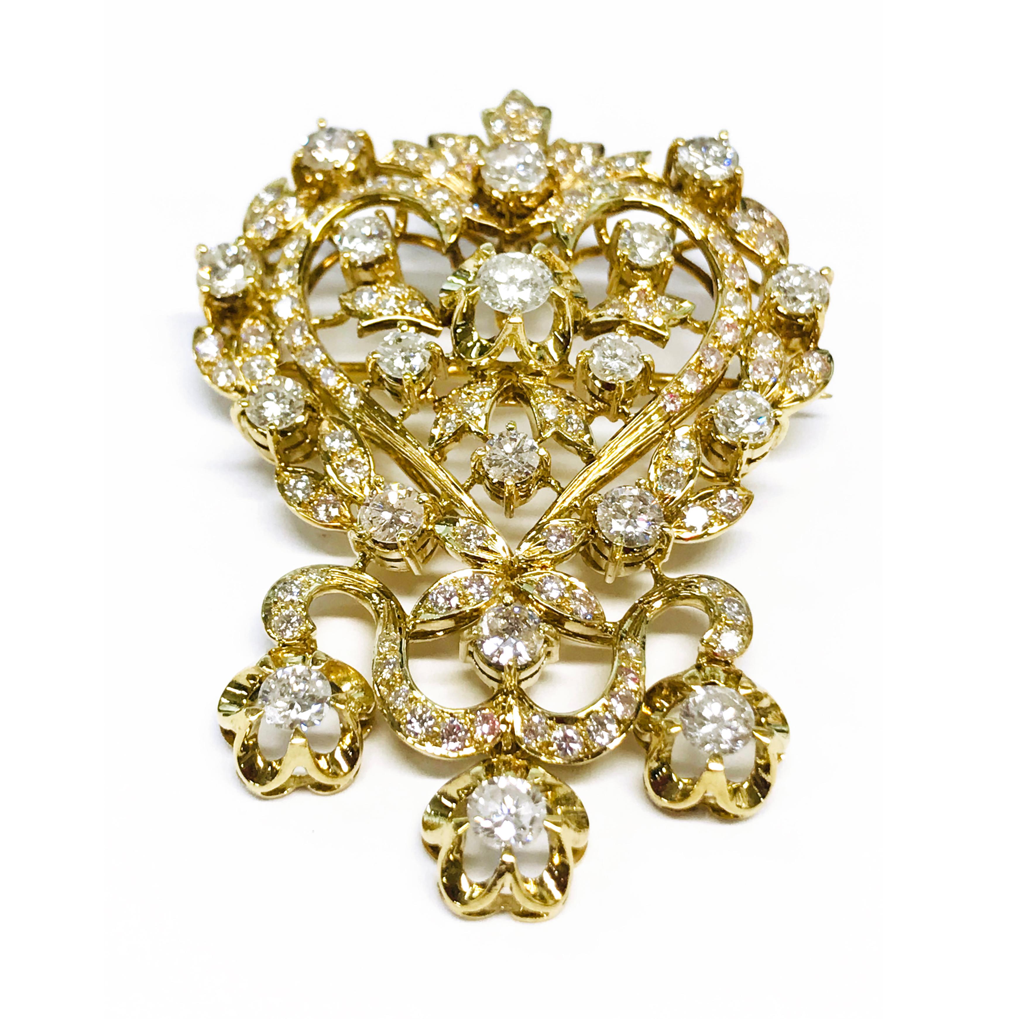 18 Karat Edwardian Diamond Brooch Enhancer Pendant. Fantastic brooch with a center ribbon forming a heart, leaves and flower details masterfully crafted. One round 4.04mm diamond for a total weight of 0.23ct. Four round 3.6mm diamond for a total