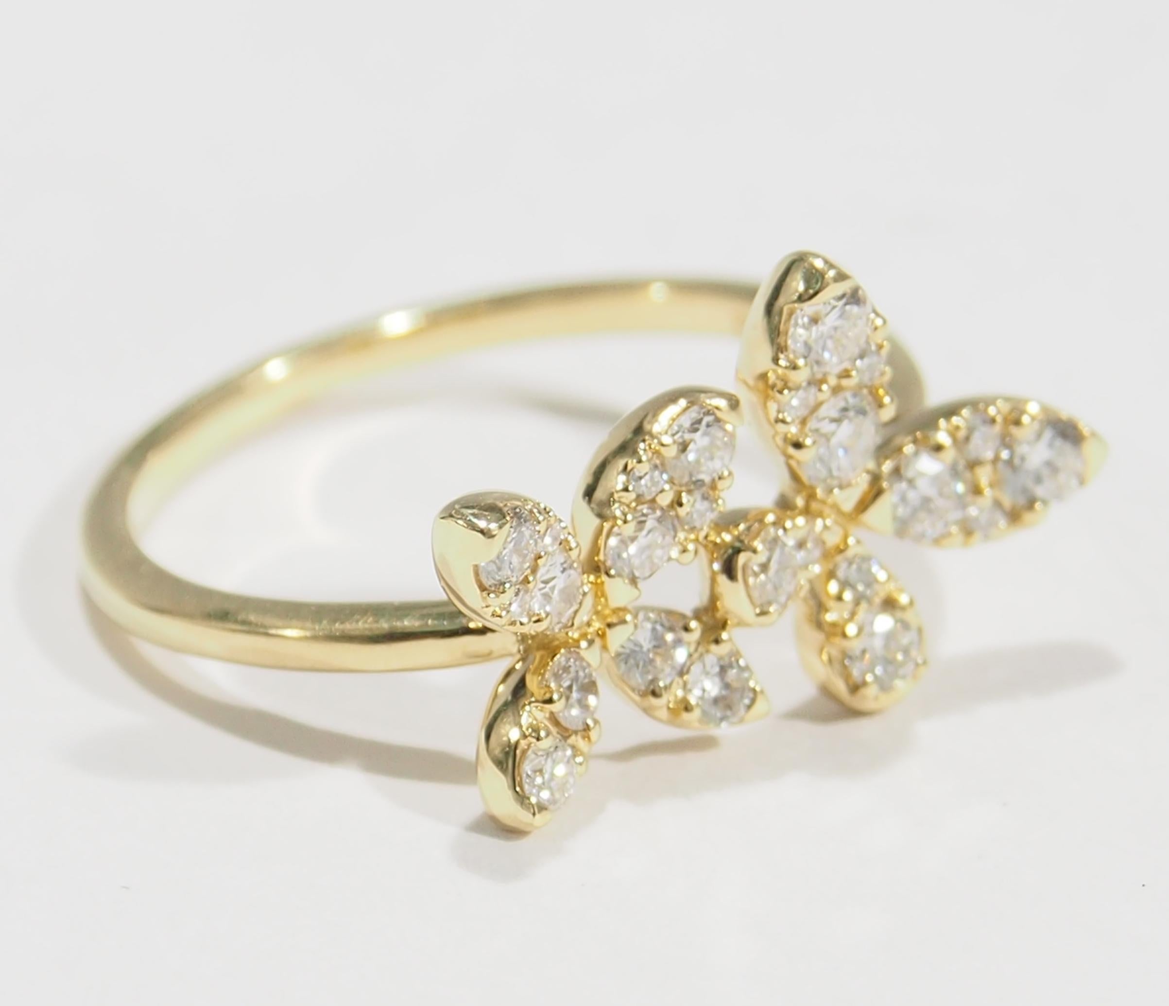 This is a delightful 18K Yellow Gold Ring fashioned with Double Flowers. These Flowers are sparkling with (24) Round Brilliant Cut Diamonds, approximately 0.64ctw, G-H in Color, VS-SI in Clarity creating a charming Ring. Easily worn for any occasion