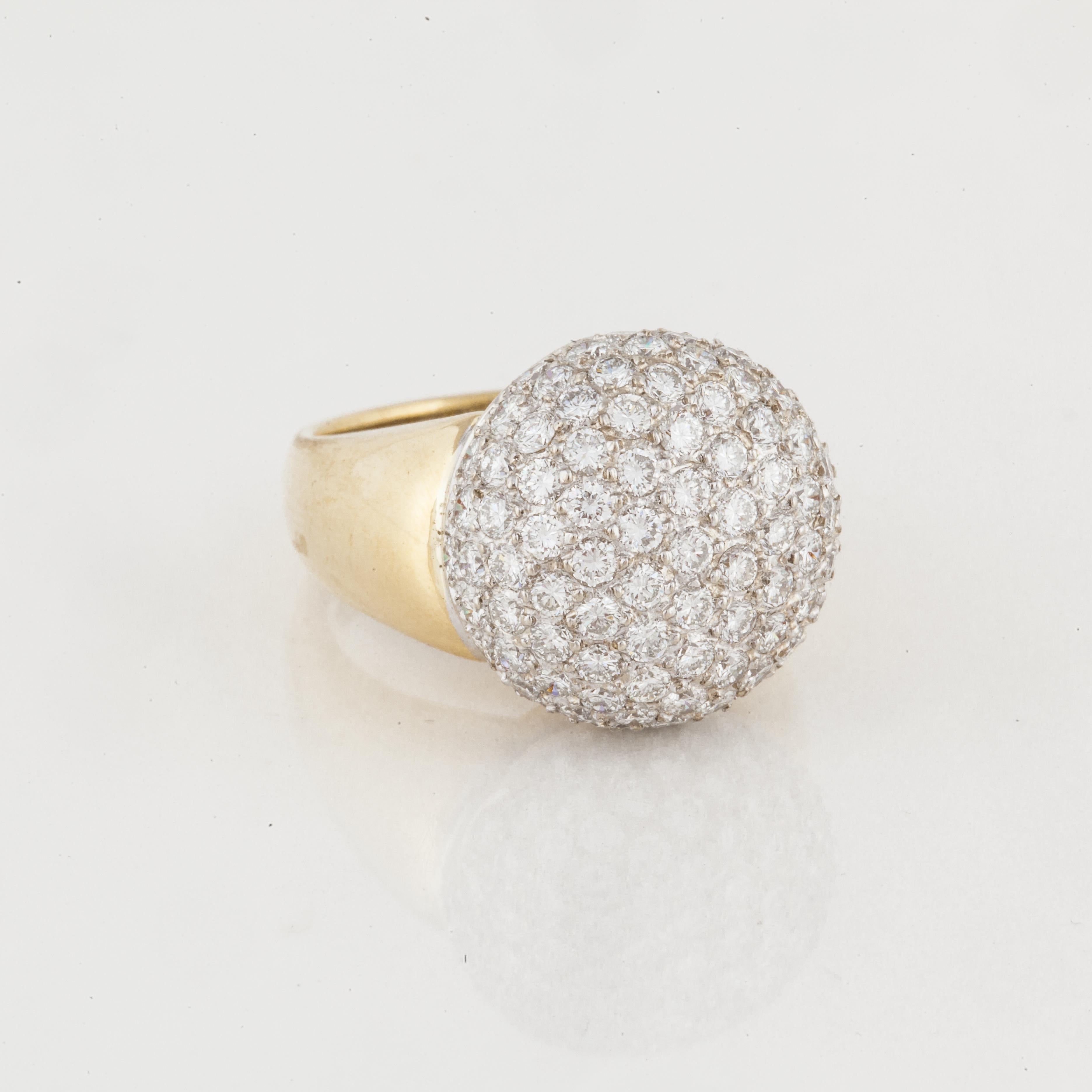 18K yellow gold ring with pavé diamonds set in white gold.  There are 95 round brilliant-cut diamonds that total 4.25 carats; G-H color and VS1-SI1 clarity.  Ring is currently a size 7 1/2 and it is 11/16 inches wide across the top and may be