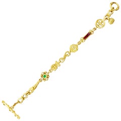 18 Karat Diamond, Emerald and Rubelite Vintage Charm Bracelet