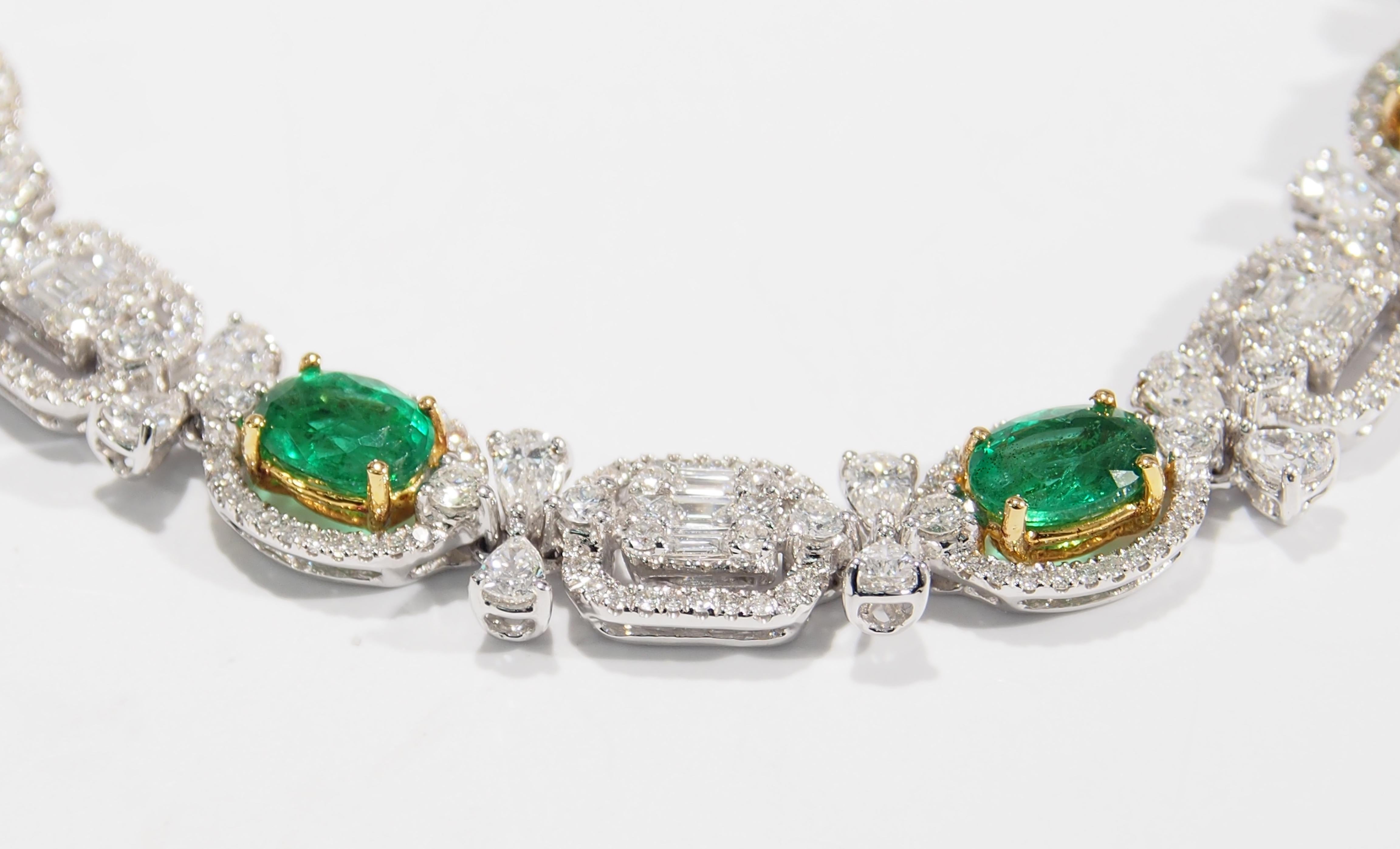 This is a lustrous Diamond and Emerald Bracelet fashioned in 18K White Gold. There are 6 Oval Emeralds, approximately 4.80ctw that are accented by 387 Sparkling Diamonds, G-H in Color, VS in Clarity. The 7 inch in length, 1/4 inch in width Bracelet