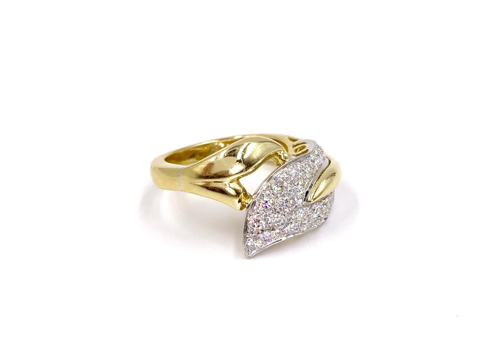 A wearable contemporary 18 karat yellow gold wrap around leaf ring containing 2.25 carats of high quality round brilliant diamonds. Diamond quality is approximately F-G color, VS2 clarity and beautifully set in white gold prongs for an extra bright