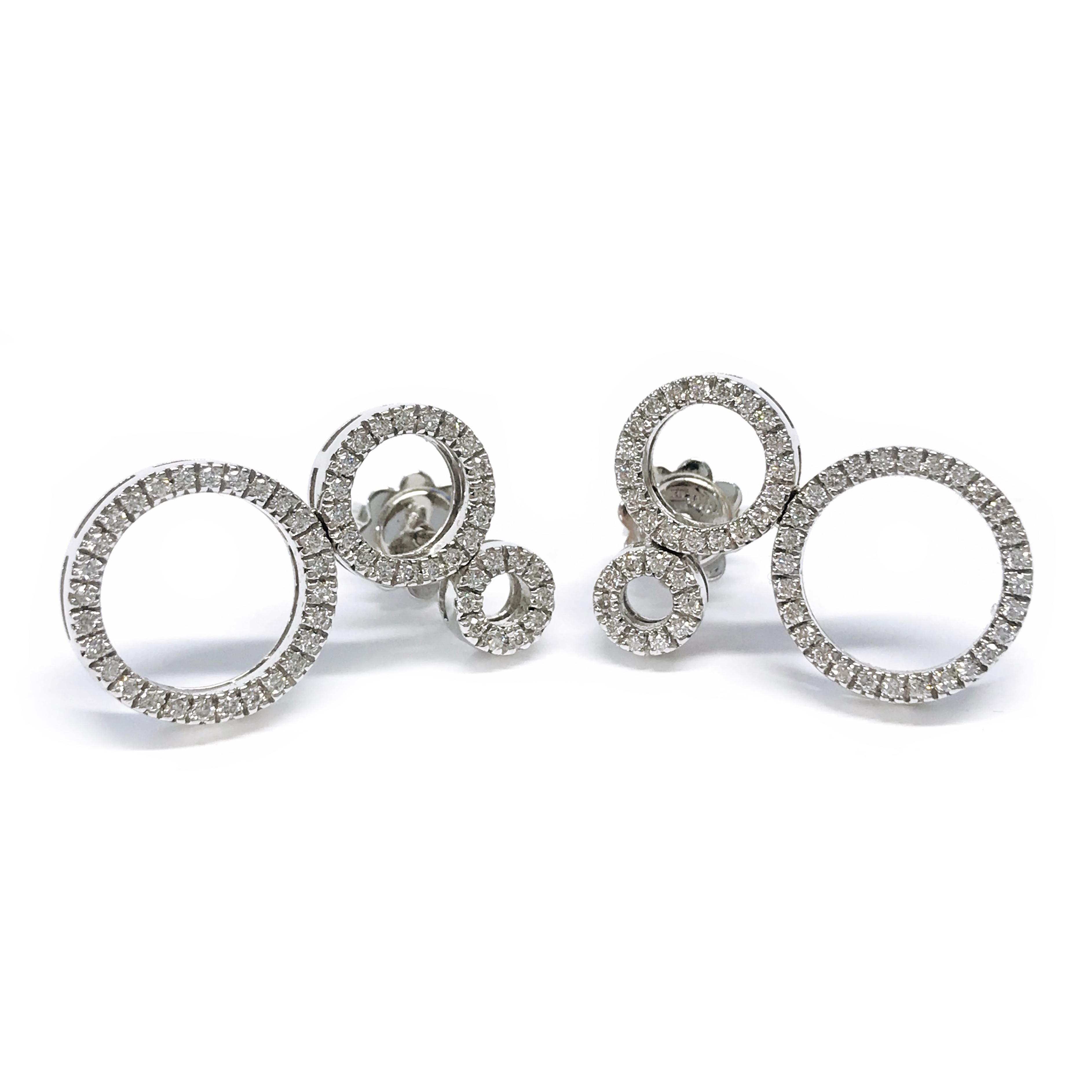 18 Karat White Gold Diamond Multi-Circle Earrings. These beautiful and whimsical earrings consist of pave-set diamonds in three different size circles, the earring backs are smooth. The diamonds are brilliant-cut with a total weight of 0.55ctw. Each
