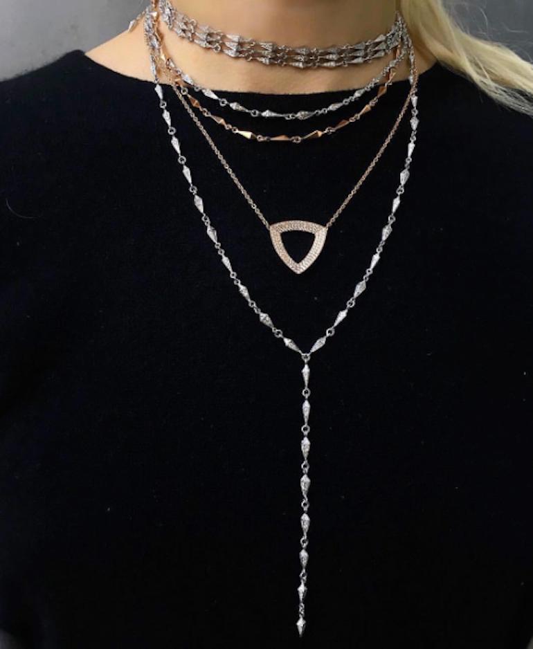 18 Karat Diamond Geometric Trilogy Necklace features a large three dimensional faceted triangle pendant set in 18k White Gold with pave white diamonds on an 18 inch Rose Gold chain
Includes lobster clasp closure at back of the neck
18k White Gold,