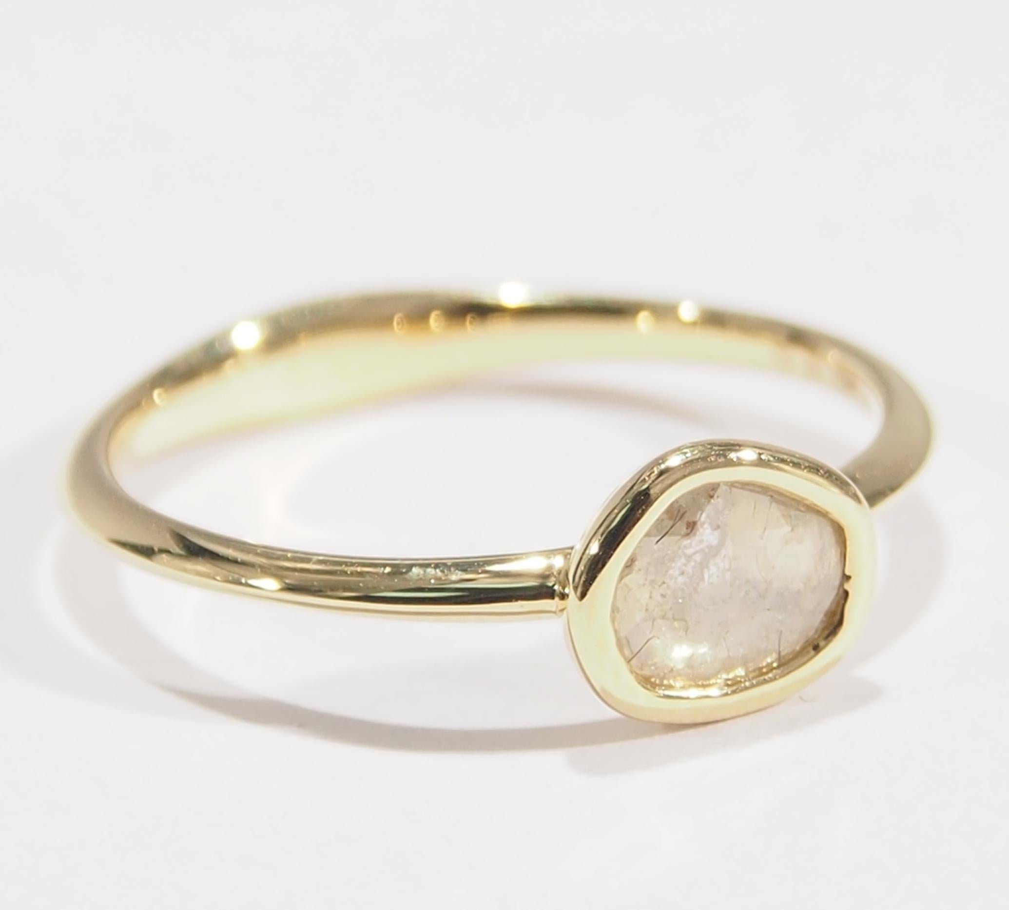 This is a delightful 18K Yellow Gold Ring fashioned with a Diamond 