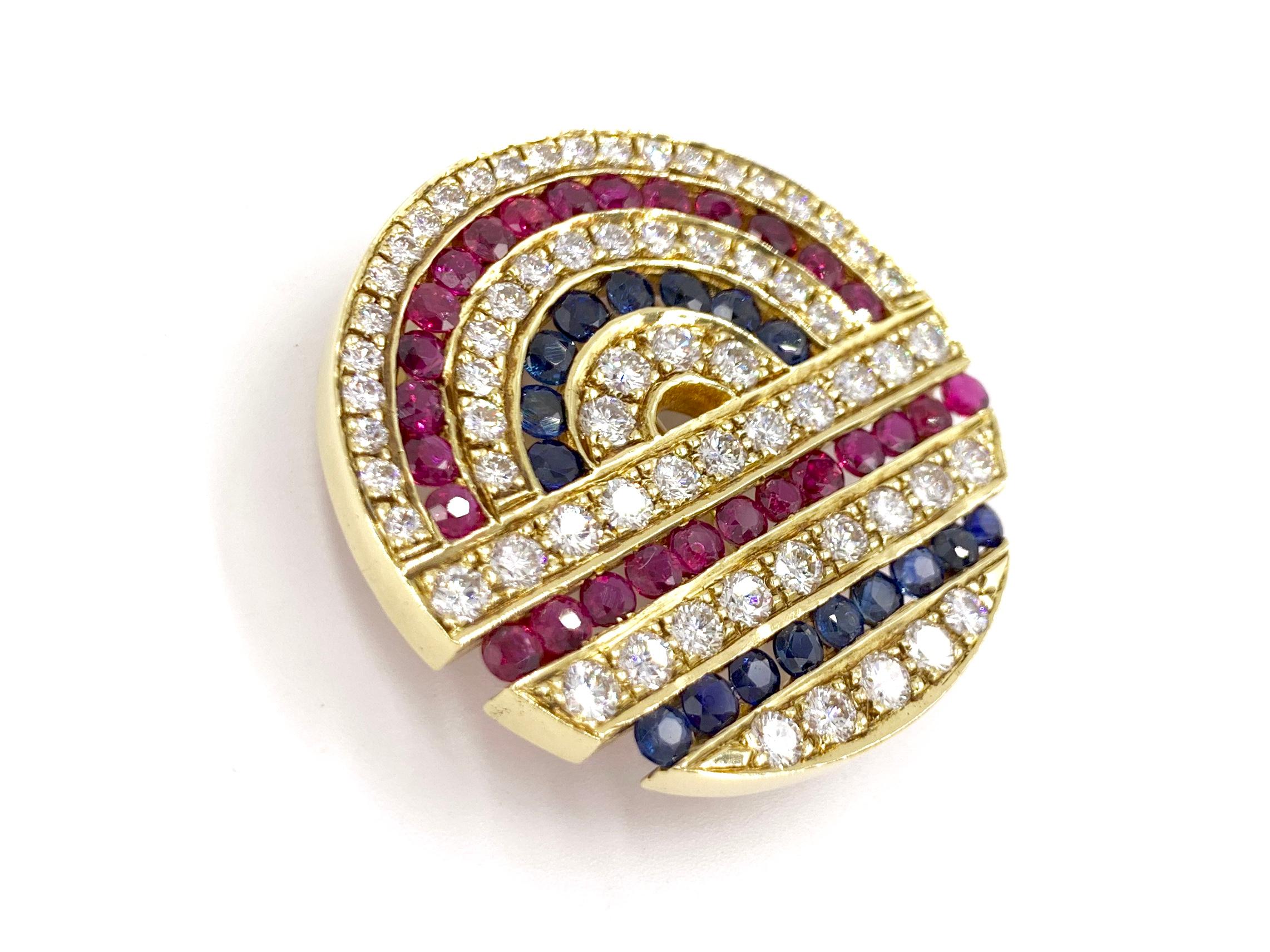 A substantial and very well made round 18 karat gold, diamond and precious gemstone medallion slide pendant that doubles as a brooch. This 34mm slide pendant has a generous amount of sparkle with a combined total weight of 8.33 carats of high