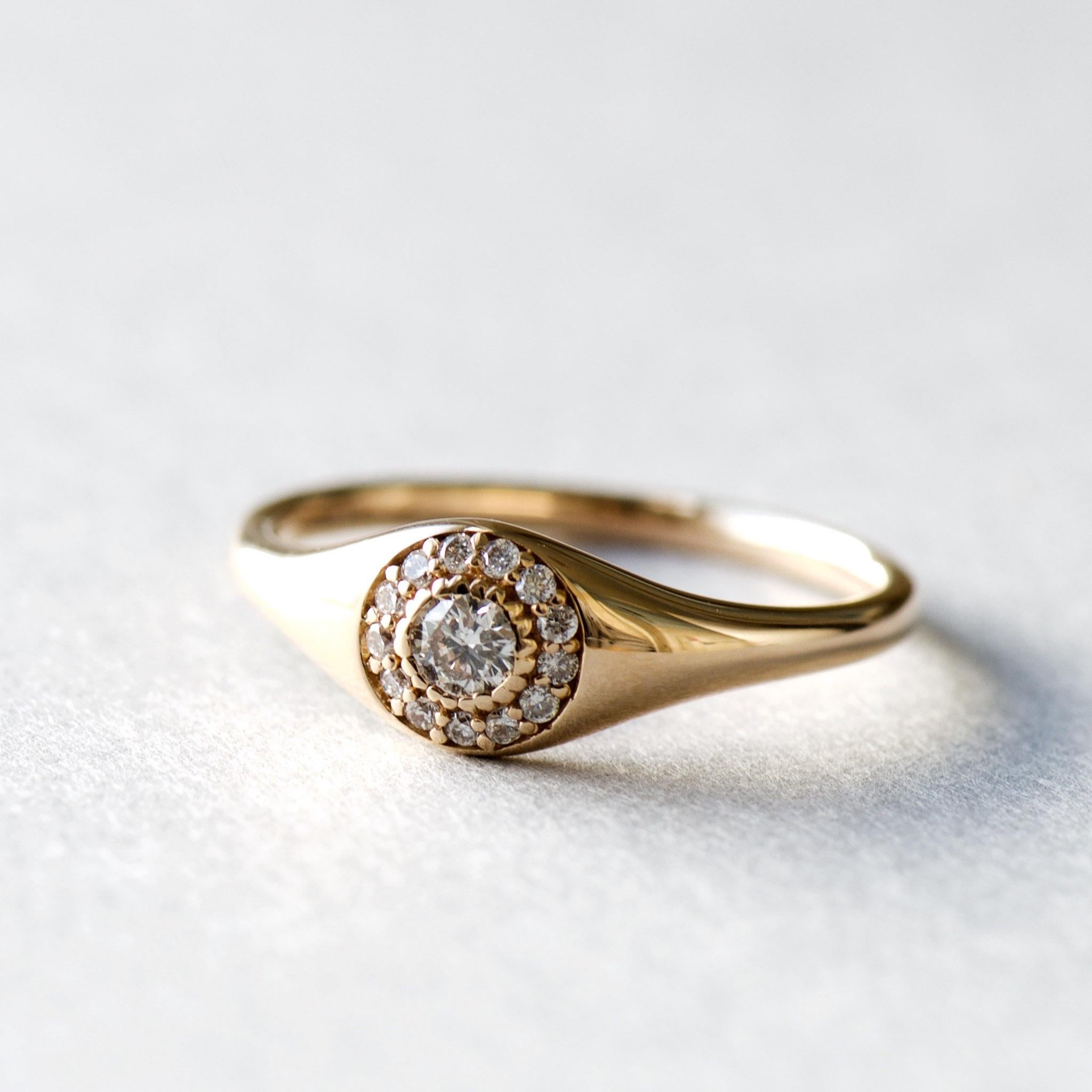 Eye catching sleek signet ring with 3mm diamond set on 18k rose gold.
AU750 fully hallmarked
Main stone: 3mm Diamond: 0.120ct
13 melee diamonds: 0.076/13ct
Total ring weight: 2.889g
Total gold weight:2.85g
Clarity: SI
Length: 6mm face with 1.76mm