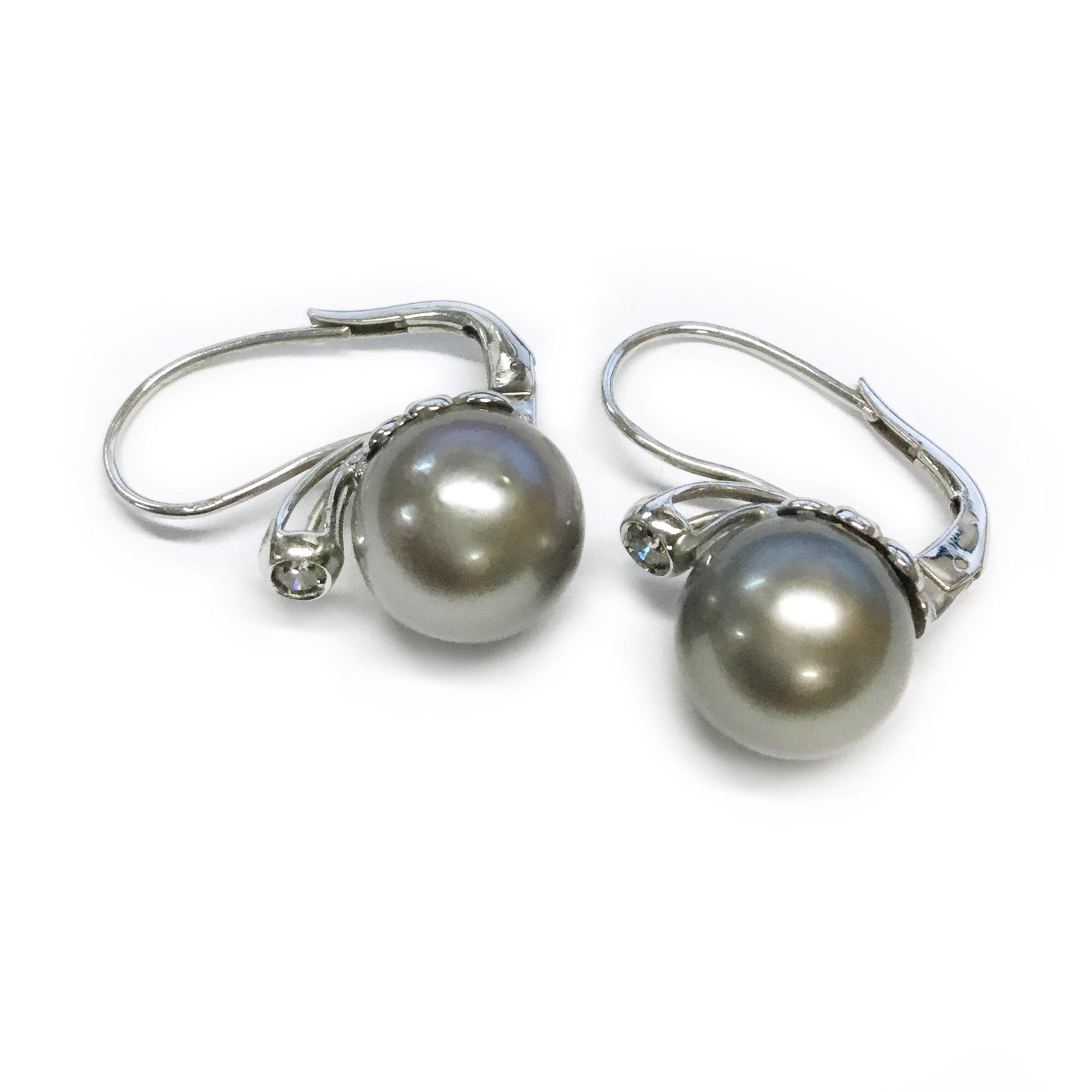 18 Karat Tested White Gold Diamond Tahitian Silver Pearl Earrings. The Pearls are 11.8mm and 11.97mm. Pearls are lightly blemished, good shape and good luster. Diamonds are I1 (G.I.A.) in clarity and I in color (G.I.A.). Diamonds are 3.2mm and have