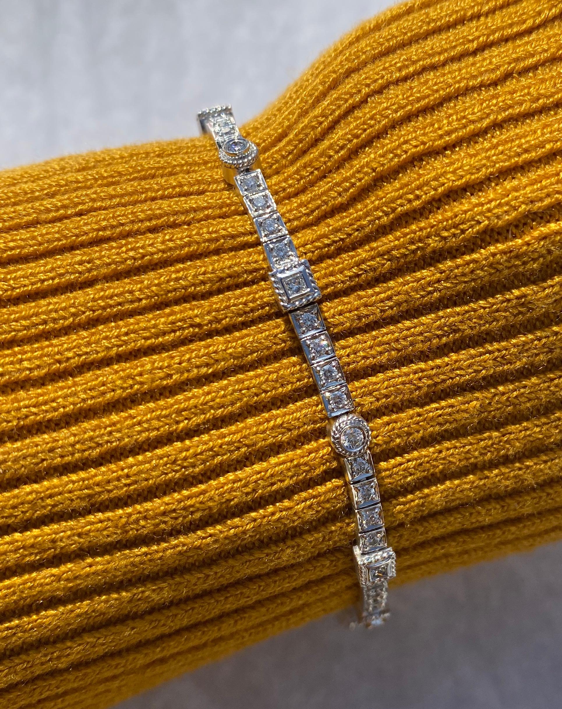 7 inches in length
Measures 4 mm wide alternating 'round and square' bezeled diamond links. 
Durable diamond clasp
60 round quality diamonds, VS clarity, and G color.
The total weight of the bracelet is estimated at .60 carat.
12 grams of 18 karat