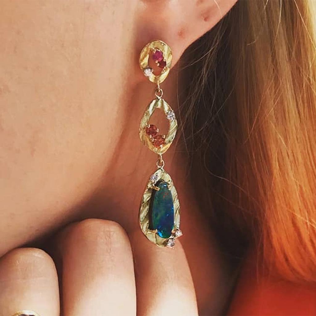 K.Mita's colorful Vivian Earrings takes contemporary to the next level. Her dangle earrings, which are 55 mm long and 6.5 mm wide, are handmade from 18 Karat Yellow Gold. These one-of-a-kind earrings from the artist's Sand Dune Collection feature