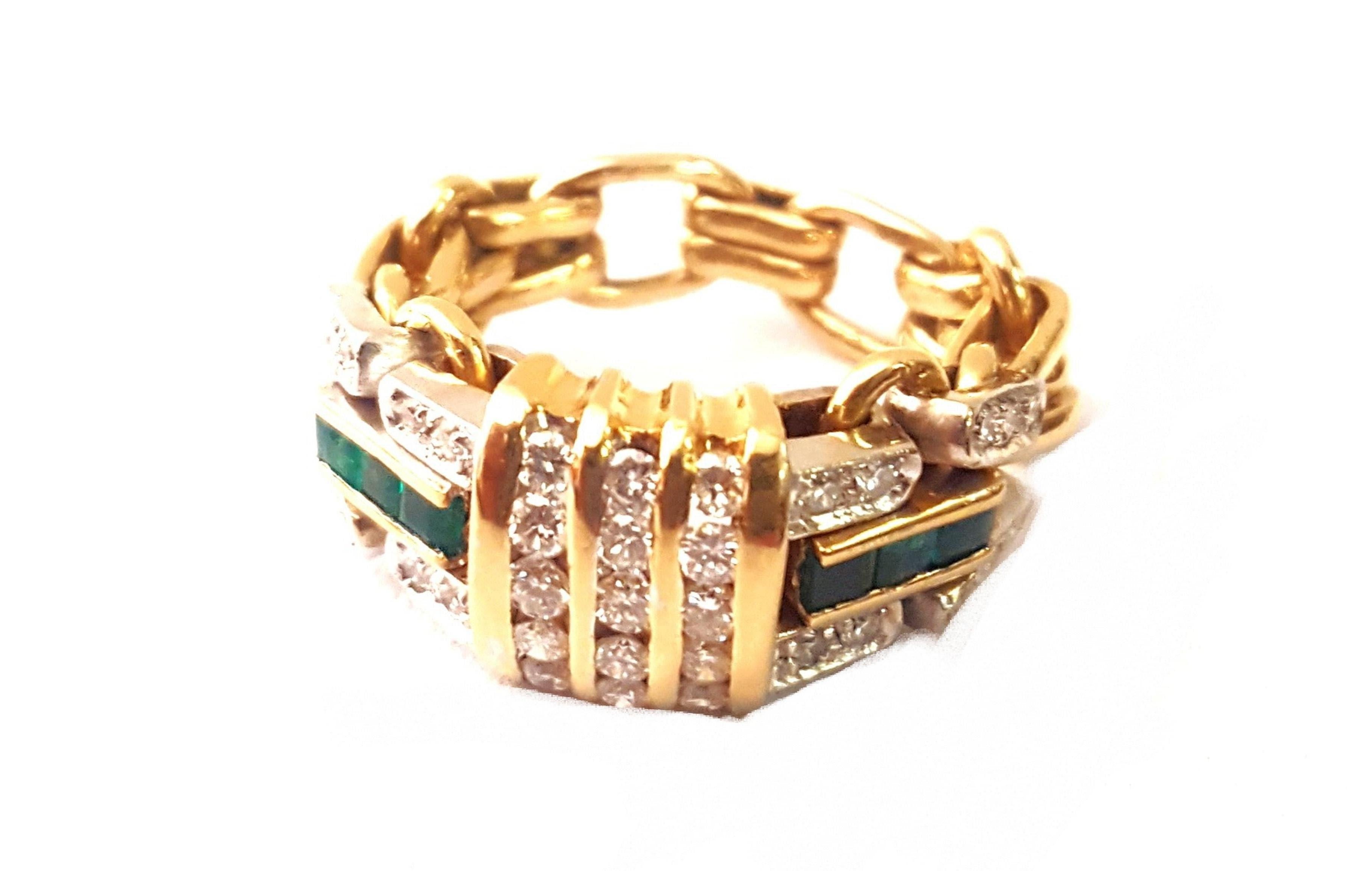 Italian craftsmanship explains itself in this spectacular 1950's creation!  Artfully crafted in 18 karat yellow gold this unusual piece features three rows of channel set white diamonds as the focal point.  On each side find four rows of prong set