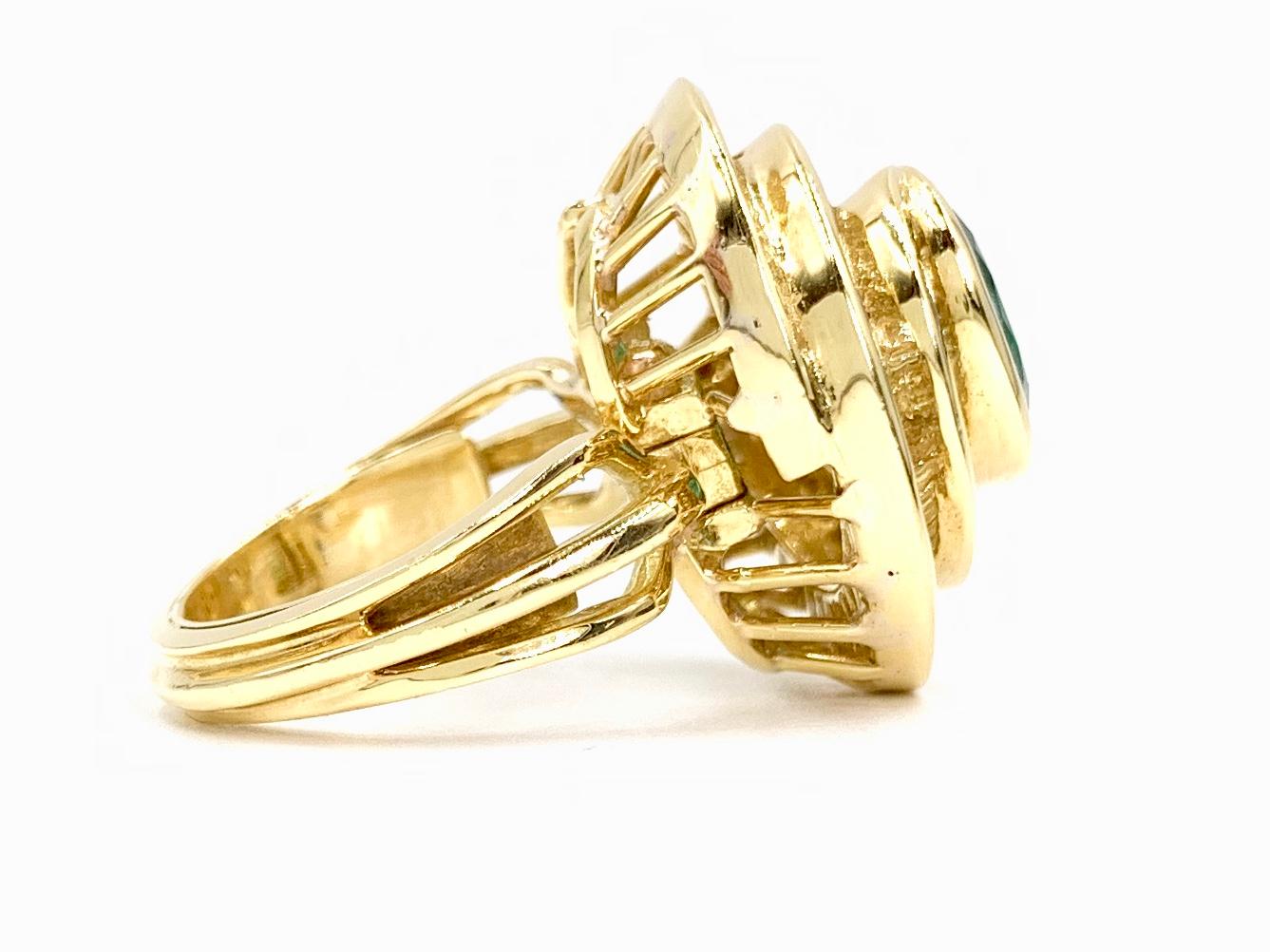 Modern 18 Karat Emerald and Diamond Swirl Cocktail Ring For Sale