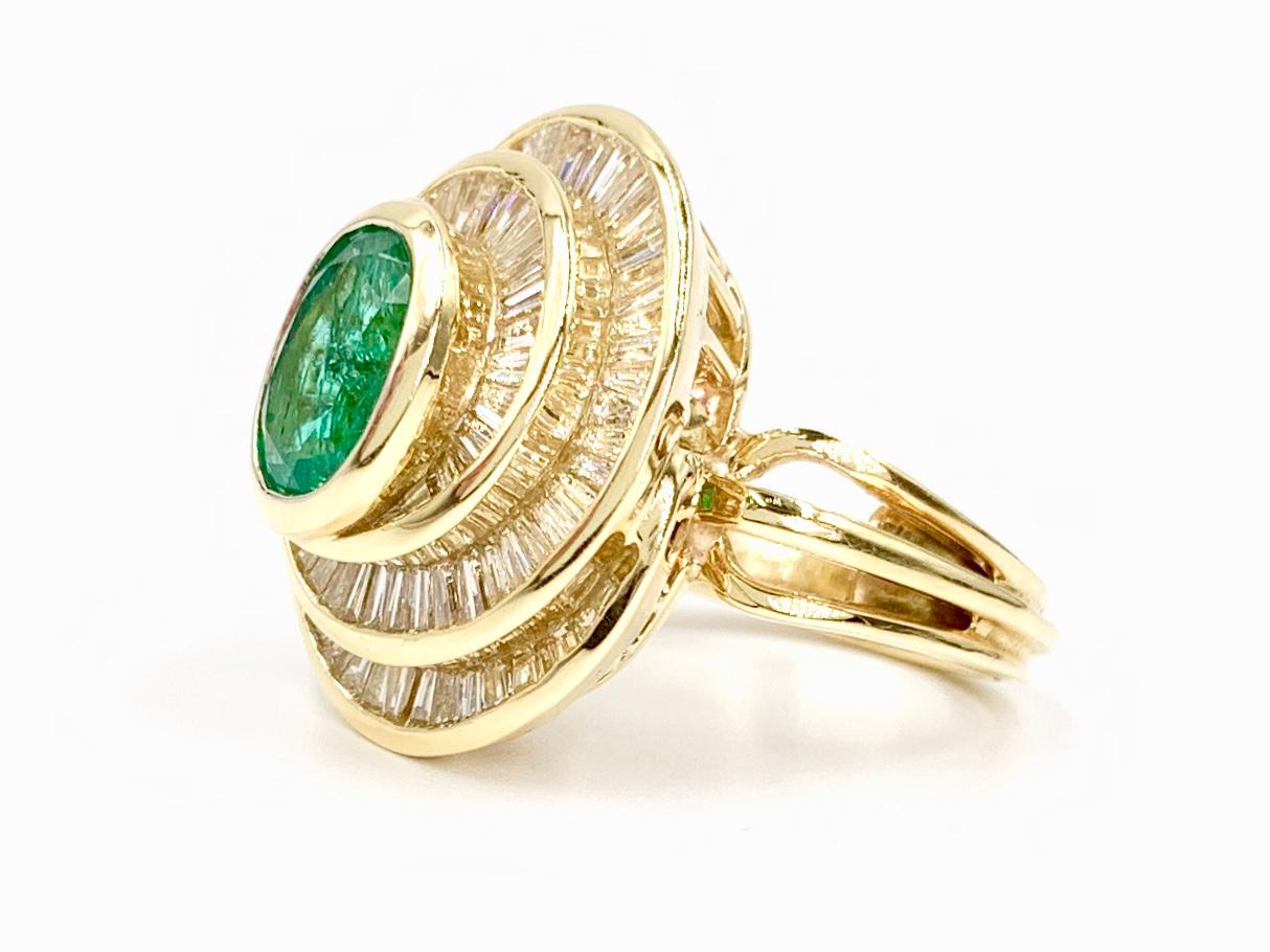 Women's 18 Karat Emerald and Diamond Swirl Cocktail Ring For Sale