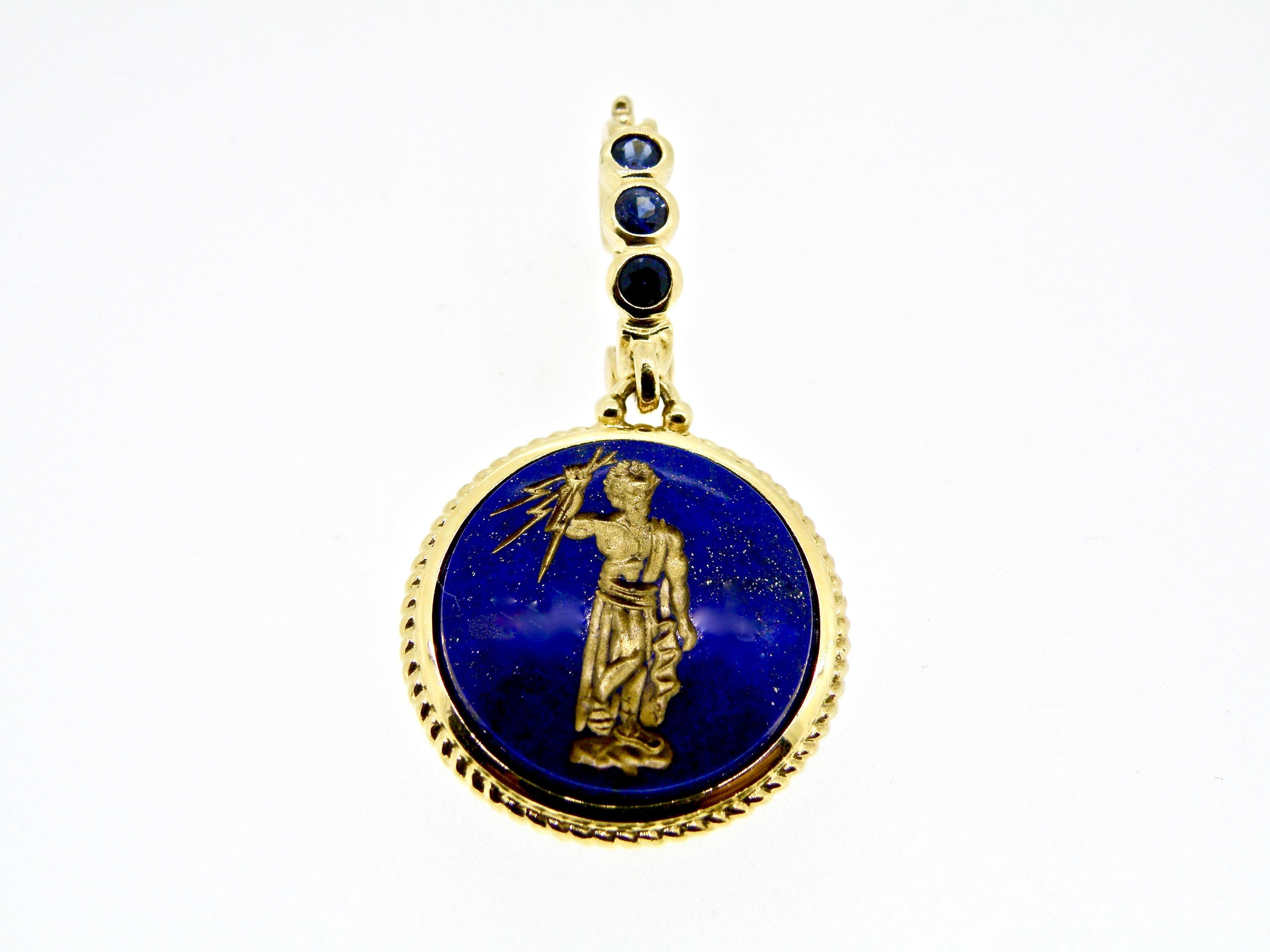 18 karat Hand Carved Lapis Lazuli “Jupiter” pendant with .30 Sapphire Bail