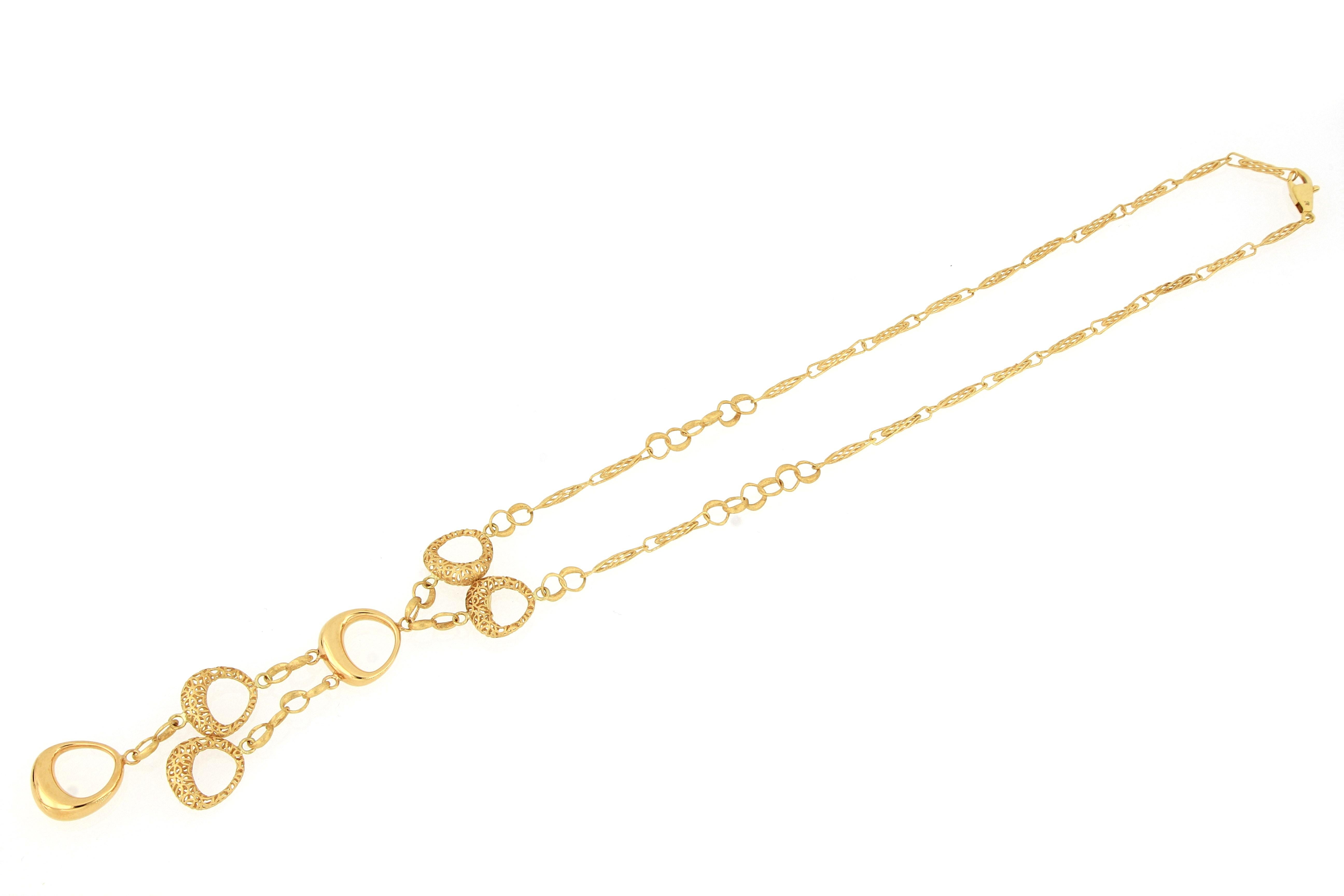 This fabulous 18 karat gold necklace, designed and made in Italy, with exquisite craftsmanship. Parts of the jewellery piece is hollowed out by electroforming and other parts are carved out and all connected by interlocking chain. The piece is