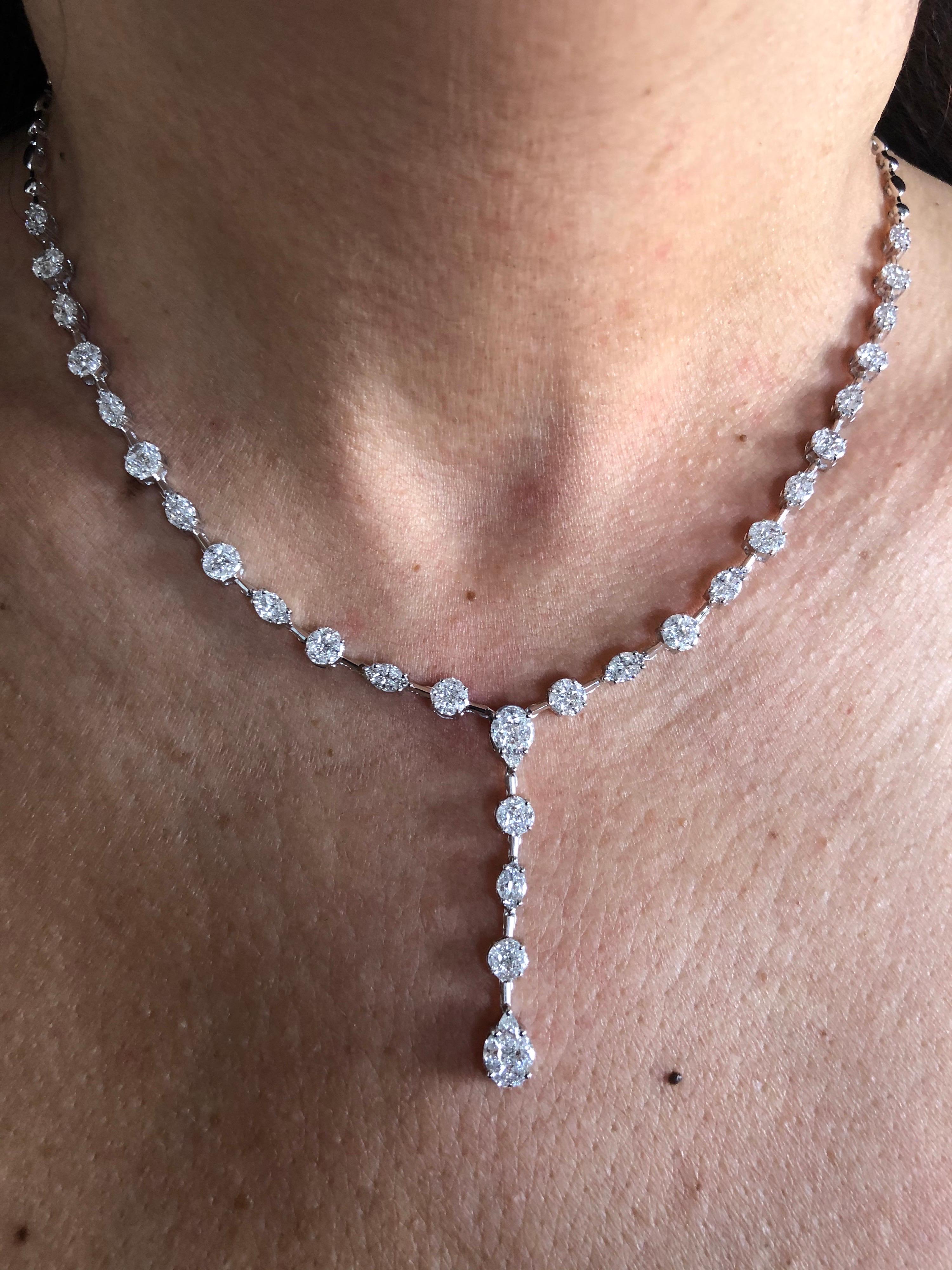 Multi cut stones that create the illusion of single round, pear and marquise shaped diamond, set in 18K white gold. The necklace is set with diamonds half way and is 17 inches in length, with an adjustable piece to make 16 inch. Total carat weight