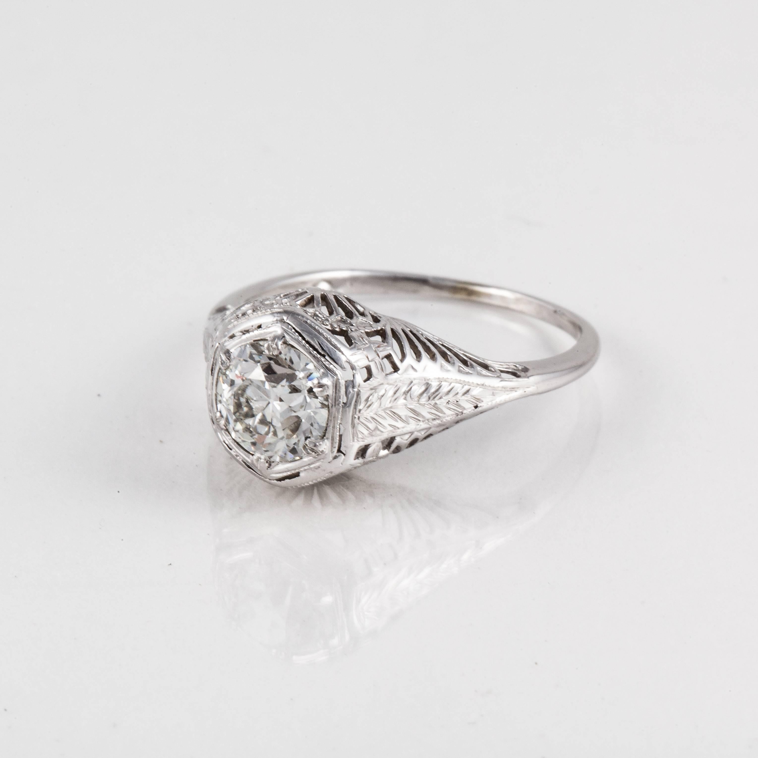 Art Deco filigree ring in 18K white gold featuring an Old European cut diamond, 0.80 carats, H color and SI2 clarity accompanied by a GIA report. Ring is currently a size 5 1/4 and may be resized. Presentation area is 1/2 inch by 3/8 of an inch and