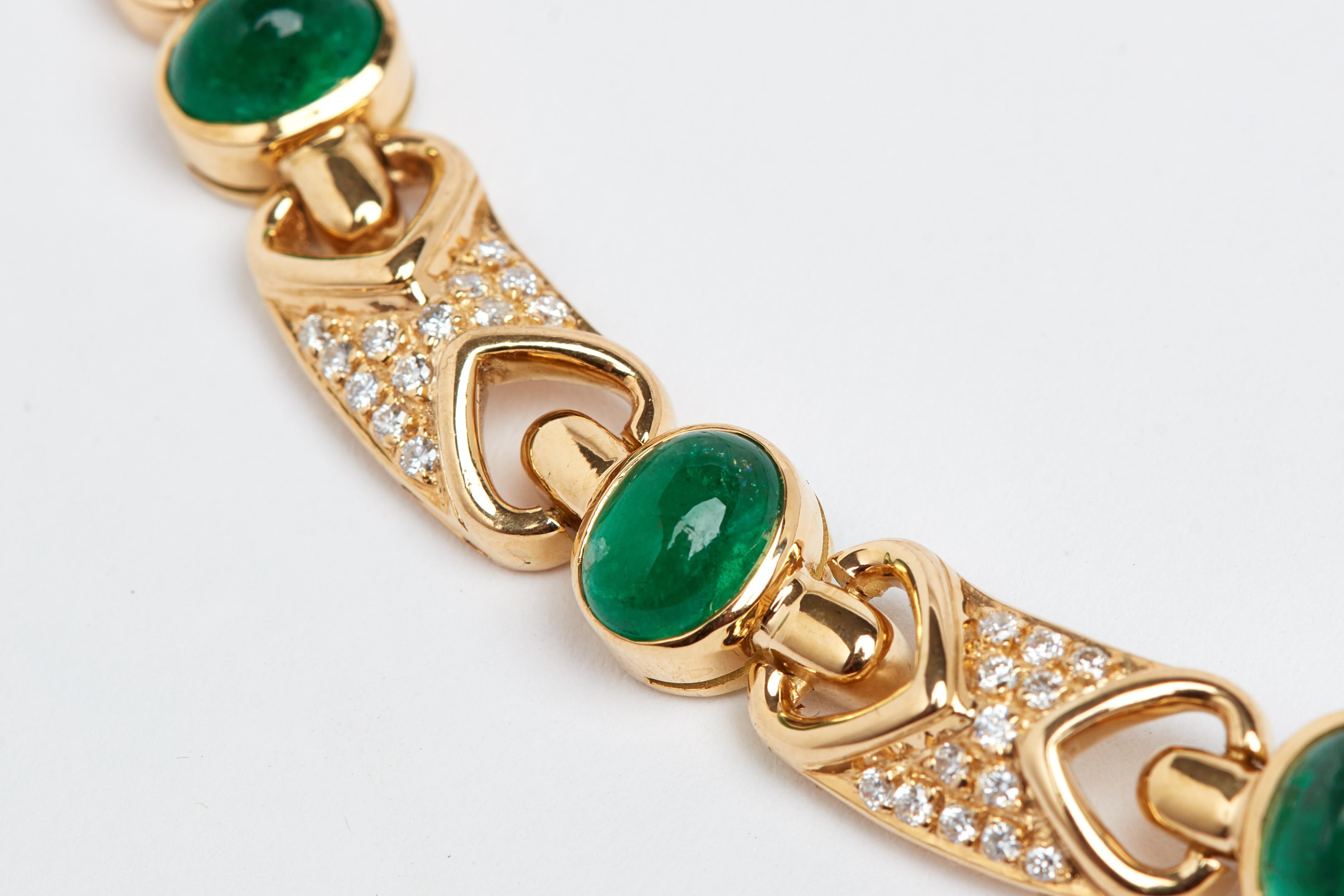 18K yellow gold cabochon emerald and diamond necklace. 15 oval cabochon emeralds weighing approximately 15 carats total. 182 white round diamonds weighing approximately 2 carats. 16 inches long. 