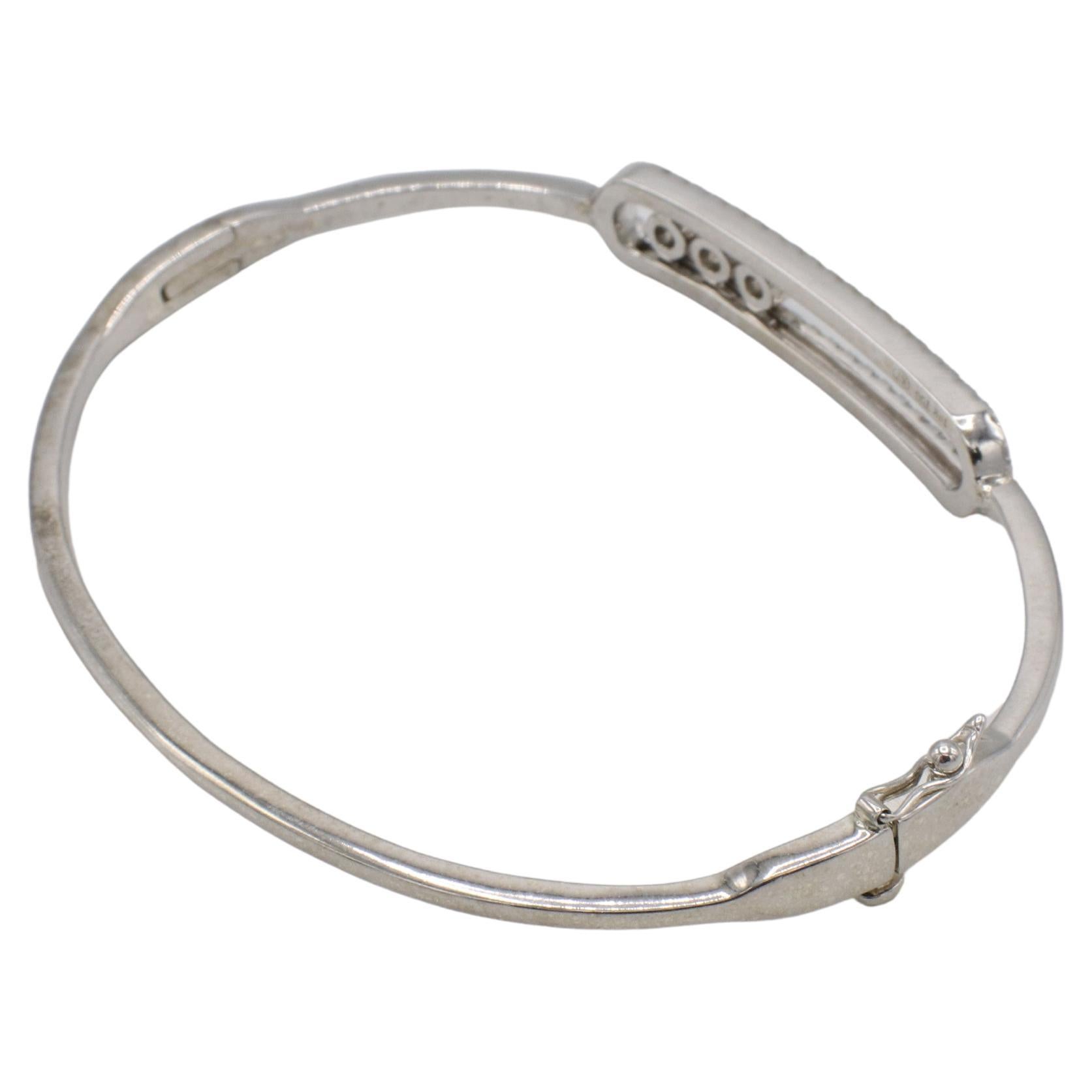 18 Karat Floating Move Natural Diamond Bangle Bracelet 
Metal: 18k white gold
Weight: 11 grams
Diamonds: Approx. 0.57 CTW G VS natural round diamonds
Size: Fits up to 6.75 inch wrist clasped
Width: 2-7mm
KTD F35000215
