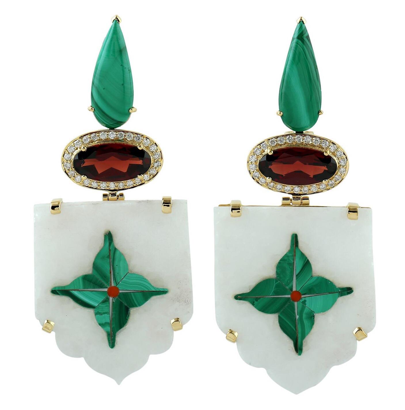 These intricate inlay earrings feature a unique hand painted floral malachite miniature art set with 18K gold & diamonds.  It is set in 7.5-carats Garnet, 7.7 carats Malachite and .56-carats of diamonds.

FOLLOW  MEGHNA JEWELS storefront to view the