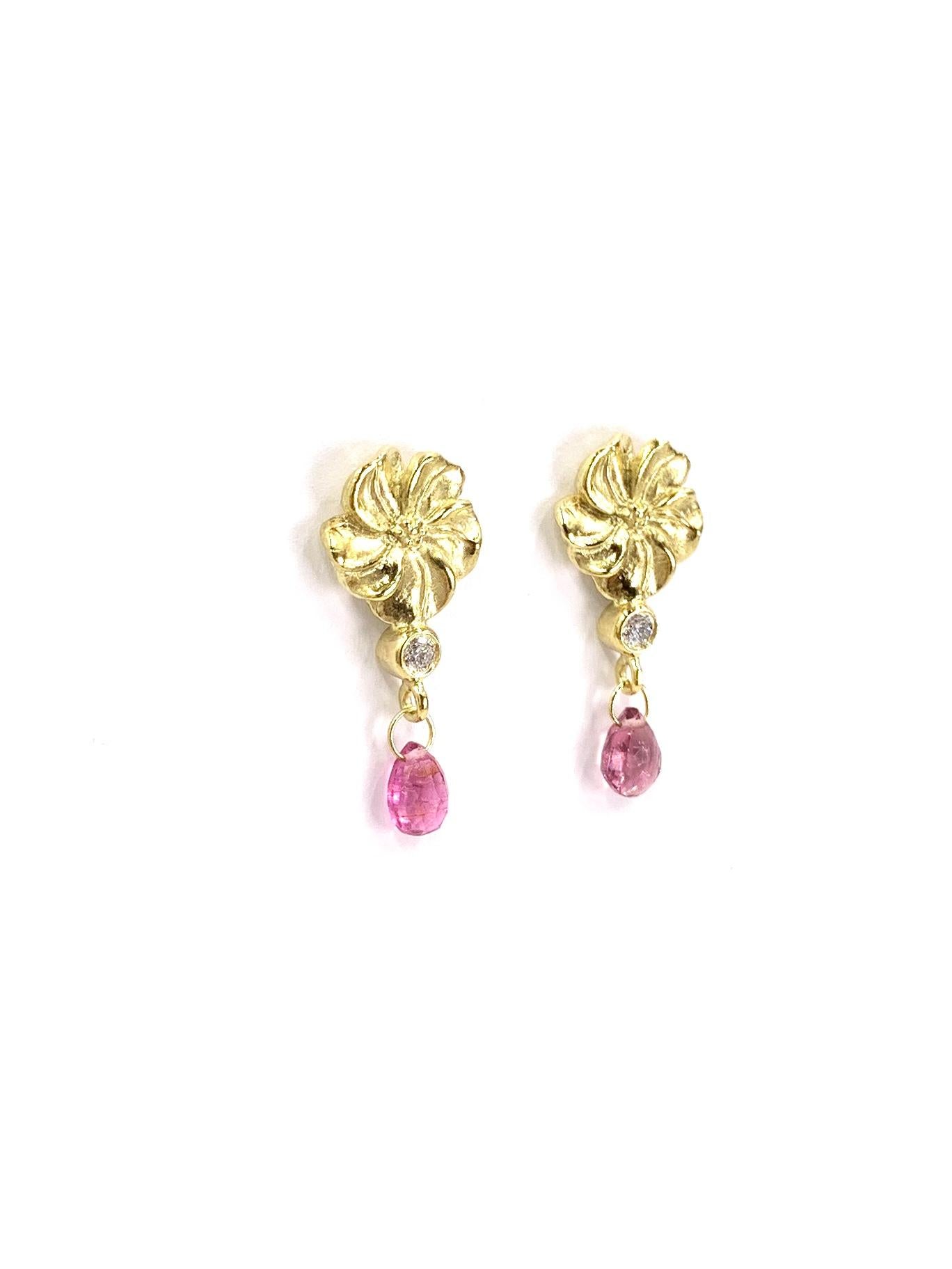 Well crafted by expert goldsmith jeweler, SeidenGang. These 18 karat yellow gold playful, every day drop earrings feature carved flowers with a single bezel set round brilliant white diamond hanging above a briolette cut pink tourmaline. Diamond